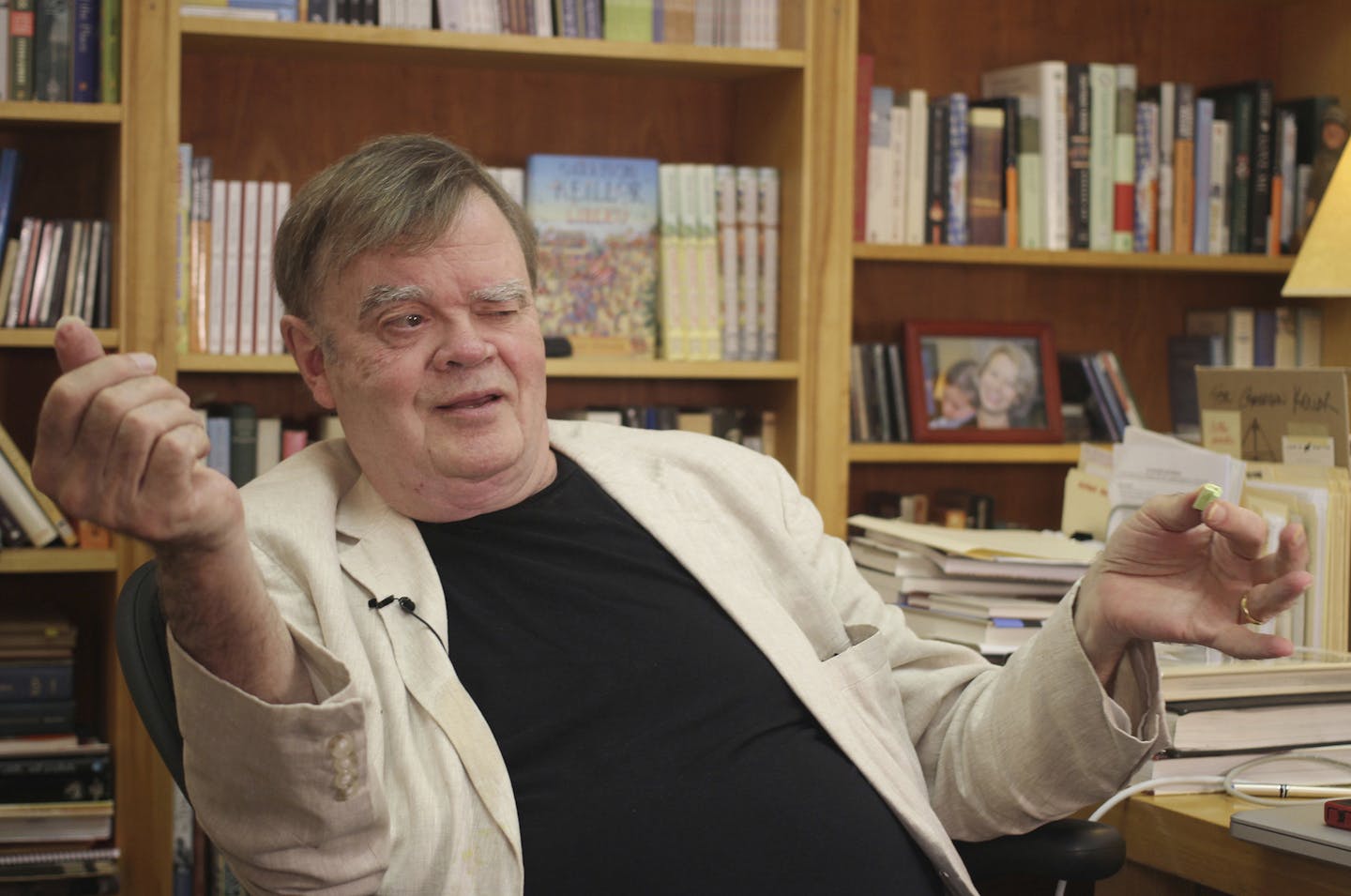 In this July 26, 2017 photo, Garrison Keillor, creator and former host of, "A Prairie Home Companion," talks at his St. Paul, Minn., office. Now that he has hung up his microphone as host of his popular public radio show, Keillor, who turns 75 this month, will embark on a 28-city "Prairie Home Love & Comedy Tour 2017," which he vows will be his last. (AP Photo/Jeff Baenen) ORG XMIT: MIN2017083115210361