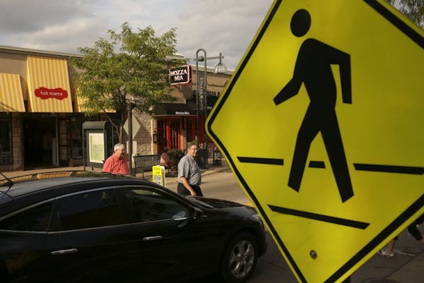 Pedestrians in Edina at W. 50th St. between France and Halifax avenues S. in Edina in 2012.