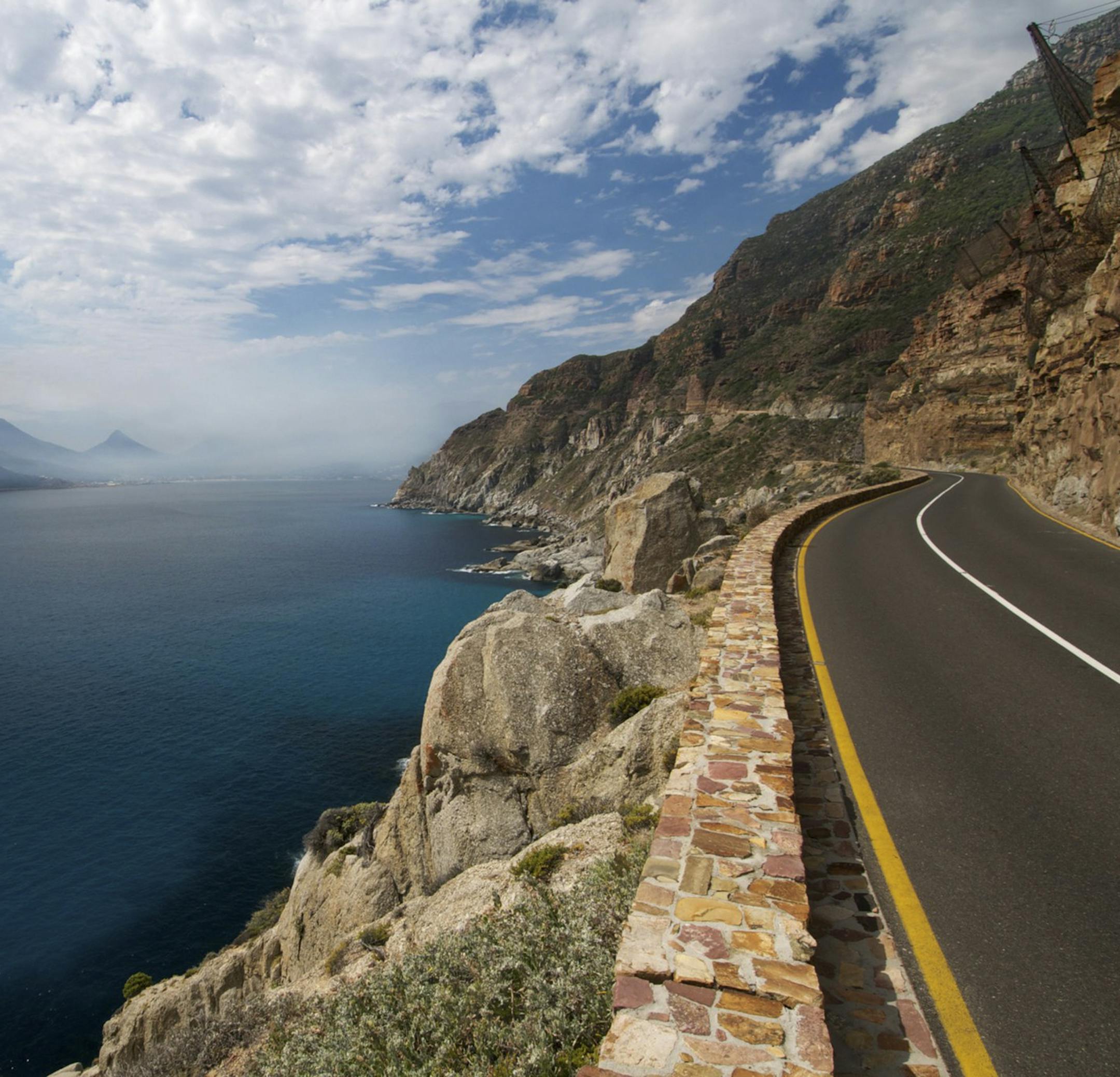 A view of Chapman’s Peak in Cape Town, South Africa, in a photo provided by AndBeyond, which provides motorcycle sidecar tours. Sightseeing tours in stylish motorcycle sidecars are catching on as a unique, fun and intimate way to explore cities around the globe. (AndBeyond via The New York Times) -- NO SALES; FOR EDITORIAL USE ONLY WITH NYT STORYSIDECAR TOURS ADV28 BY SHIVANI VORA FOR JAN. 28, 2018. ALL OTHER USE PROHIBITED.