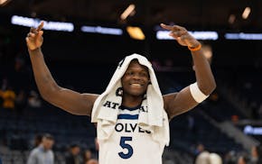 Guard Anthony Edwards celebrates as he walks off the court after the Timberwolves defeated the Golden State Warriors 117-110 in Game 4 of their NBA We