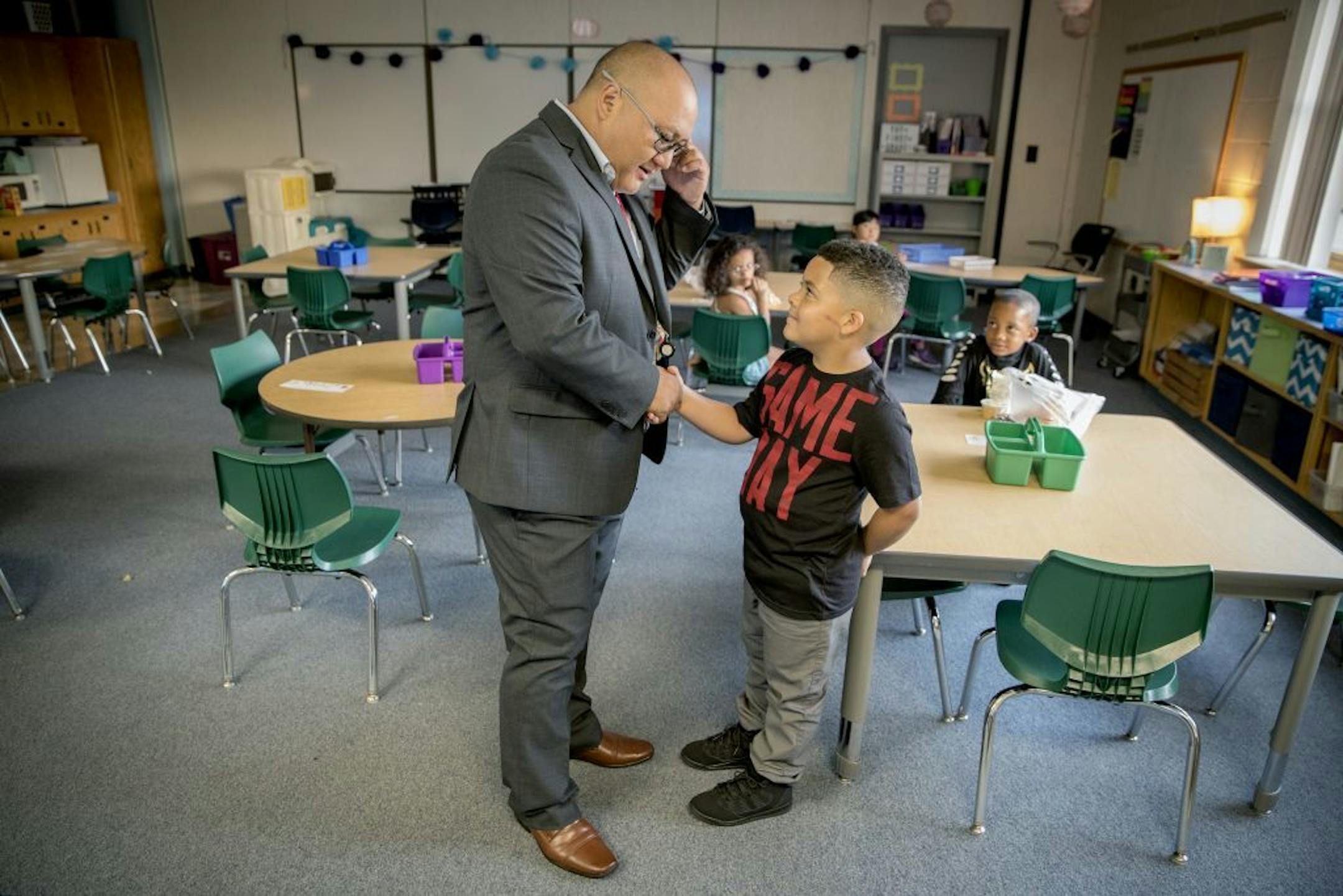 New Principal Pao Vue greeted students inside their classrooms at Jenny Lind Elementary School on the first day of school, Monday, August 27, 2018 in Minneapolis, MN.