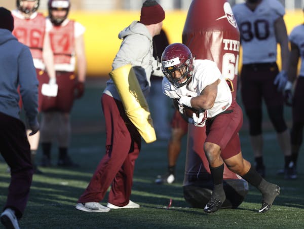 Gophers running back Rodney Smith, shown working on drills during football practice last month.