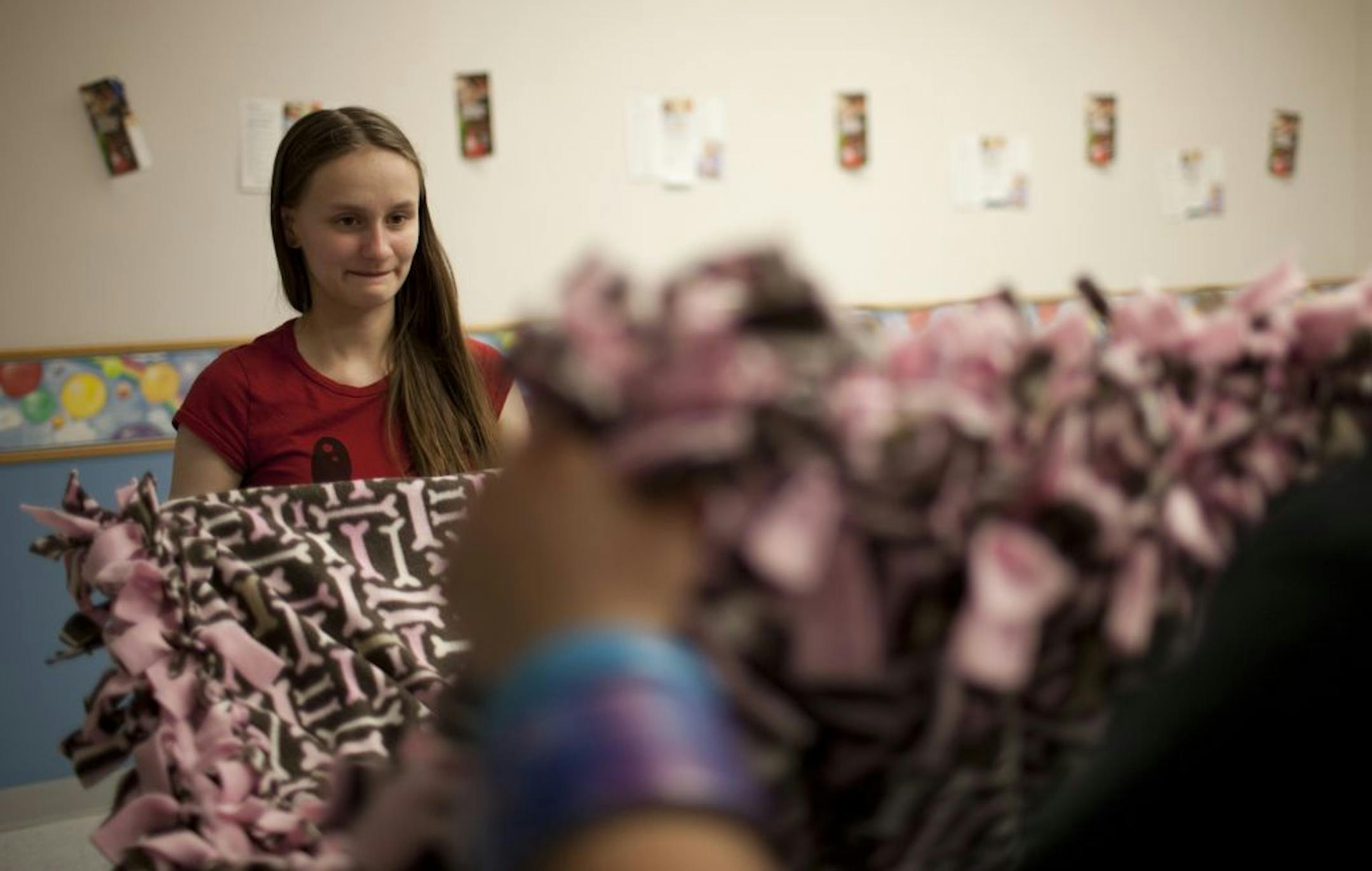 At Minneapolis Southwest High School's recent all-night party for seniors, Fiona Ihinger helped fold a completed blanket.