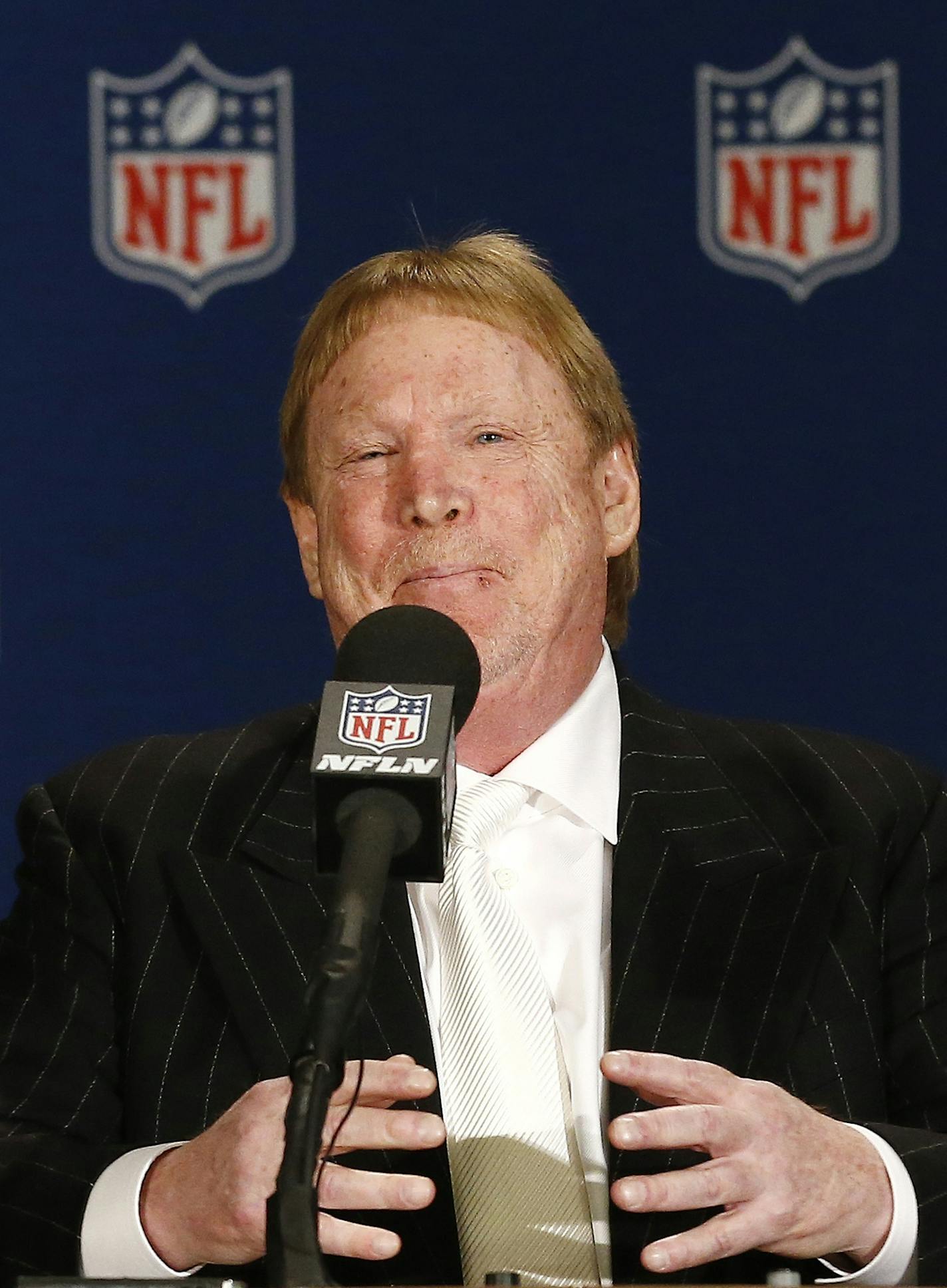 Oakland Raiders owner Mark Davis gestures during a news conference at the NFL football annual meetings after owners approved the move of the Raiders to Las Vegas, Monday, March 27, 2017, in Phoenix. (AP Photo/Ross D. Franklin)