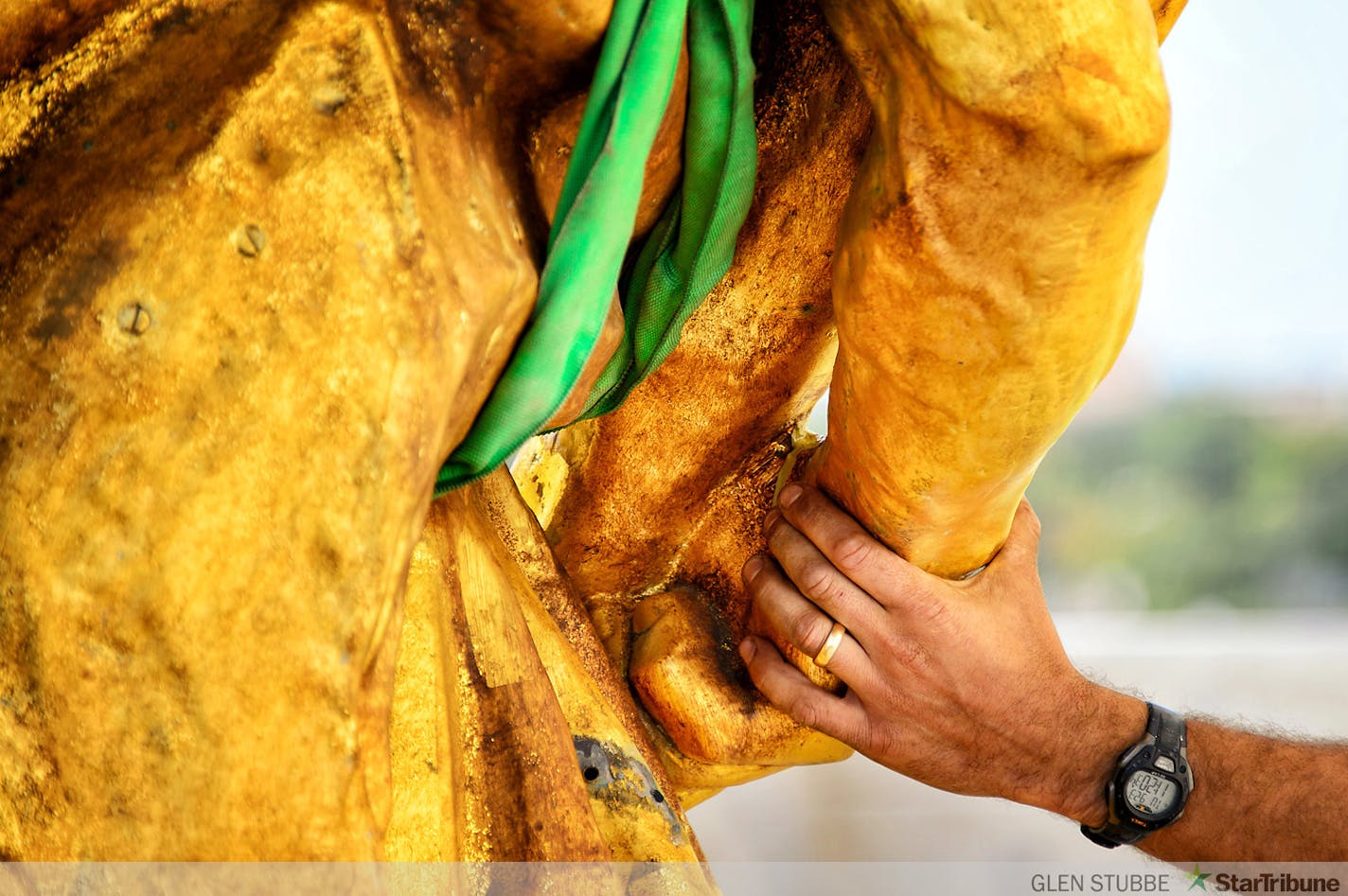 The charioteer figure who guides the golden horses on the Minnesota State Capitol Building's Quadriga statue were temporarily removed on Tuesday, September 23 to repair corrosion discovered at the statue's base. The repair is expected to take approximately three months when charioteer will return to the Quadriga.    ]   Tuesday, September  23, 2014   GLEN STUBBE * gstubbe@startribune.com