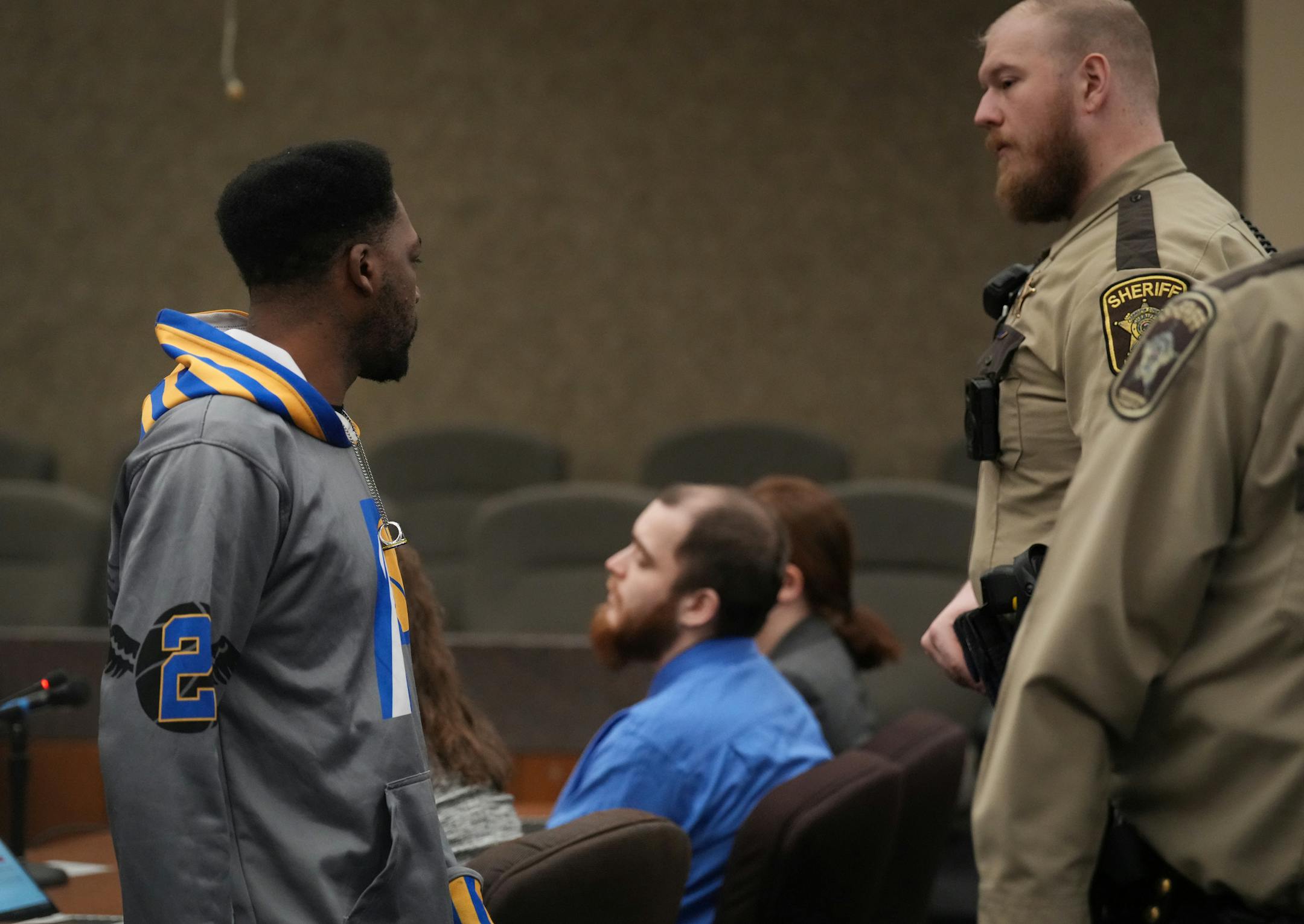 Deshaun Hill, Sr. speaks quietly to Cody Fohrenkam after giving a victim impact statement.