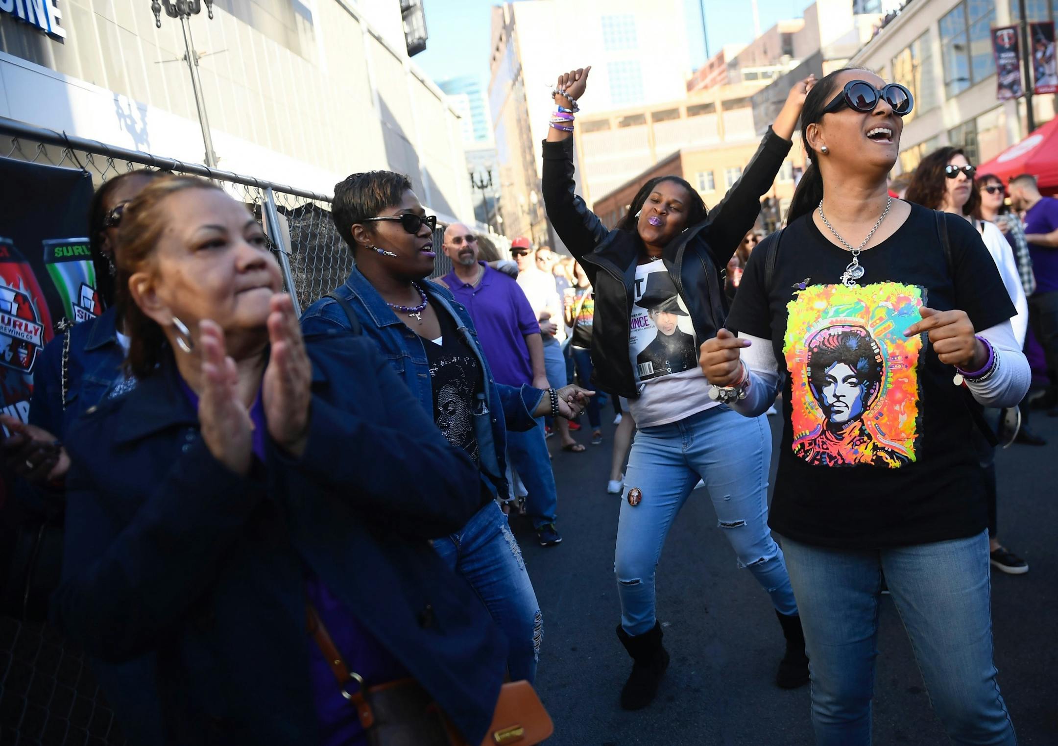 From left, Dianne Bailey, from Washington, D.C., Tonya Davis and Chauncey Cameron, of Oakland, and Timesha Carroll, of D.C., danced at Saturday's block party commemorating Prince.