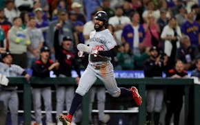 The Twins' Byron Buxton runs home for the tying run in the ninth inning Friday, his first game after dealing with a concussion.