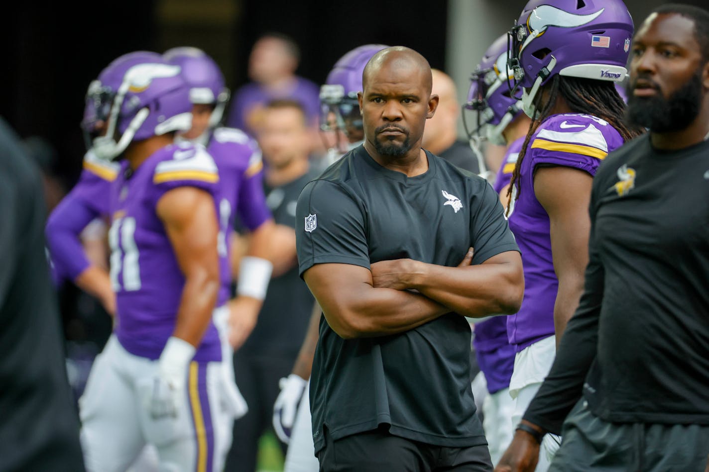 Minnesota Vikings defensive coordinator Brian Flores watches his players prior to an NFL preseason football game against the Arizona Cardinals, Saturday, Aug. 26, 2023, in Minneapolis. (AP Photo/Bruce Kluckhohn)