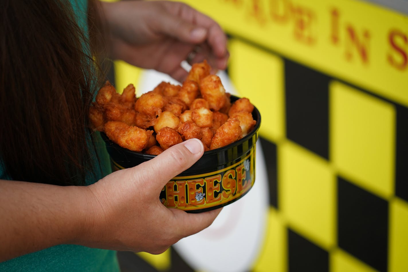 State Fair food vendors are setting up in parking lots all over the metro. At the Anoka County Fairgrounds, there's a Tom Thumb mini donuts, a cheese curd stand, and an ice cream stand. Families tailgate and make a picnic of it throughout the weekend.