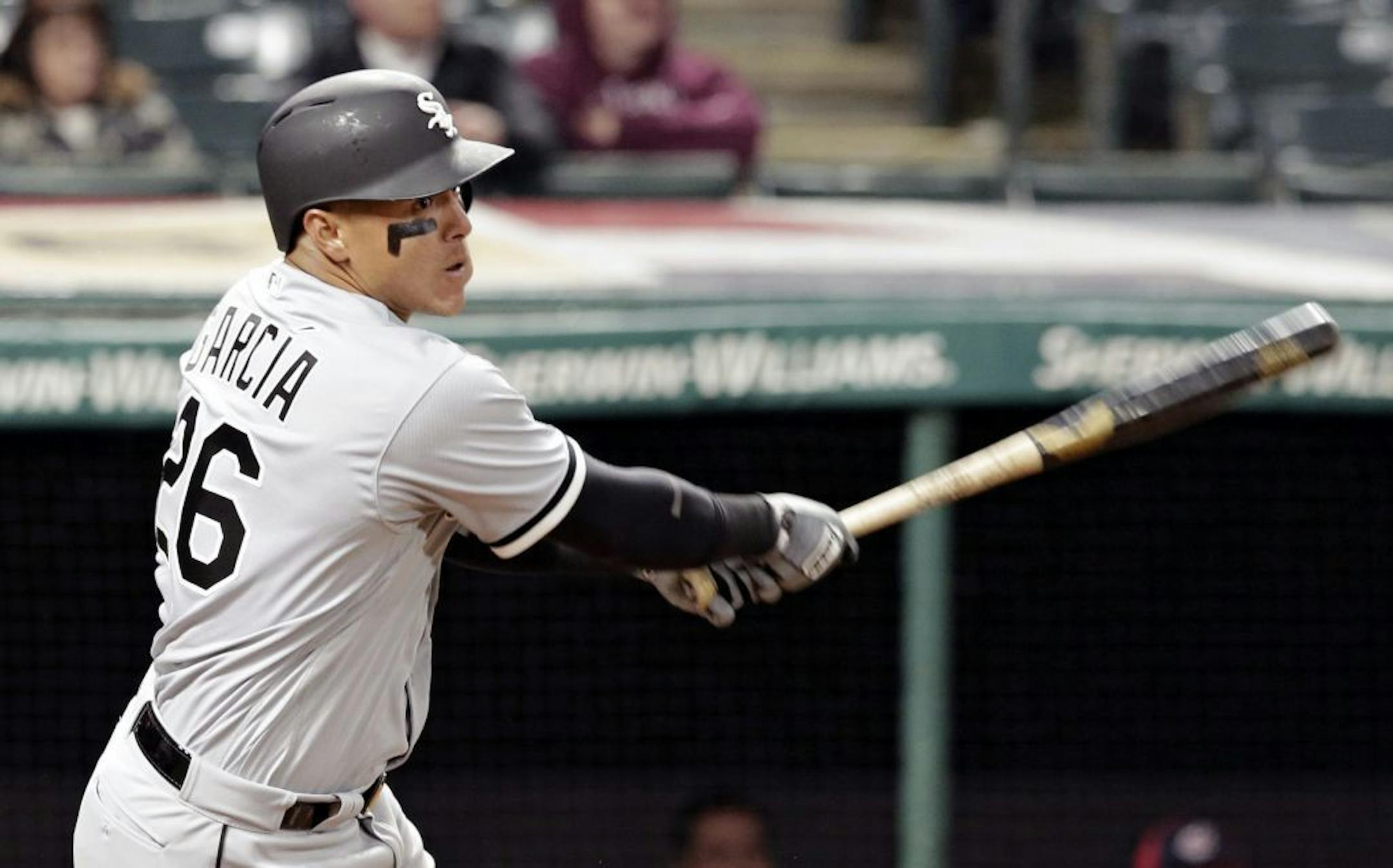 Chicago White Sox's Avisail Garcia hits an RBI-single off Cleveland Indians relief pitcher Dan Otero in the eighth inning of a baseball game, Thursday, April 13, 2017, in Cleveland. Jose Abreu scored on the play.