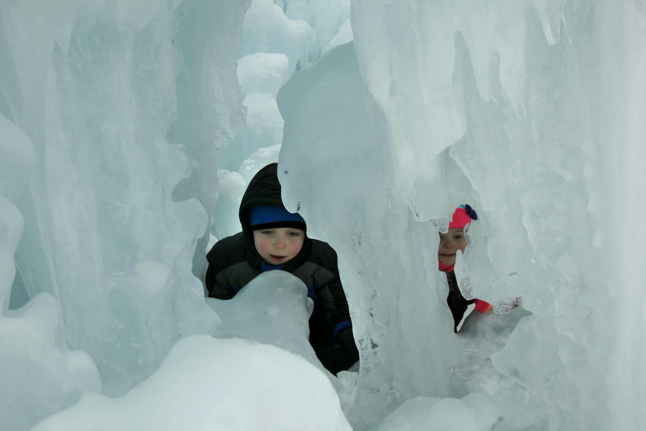 Lisa Burton of Woodbury (not shown) brought her children Luke (5 years old, left) and daughter Darcy (2 years old on thursday) to the Ice Castle at the Mall of America. "We wanted to have an ice day so we spent the morning at the St. Paul Winter Carnival and the afternoon at the Ice Castle. It is a perfect day to go with the mild weather." Bloomington, MN on January 29, 2013.