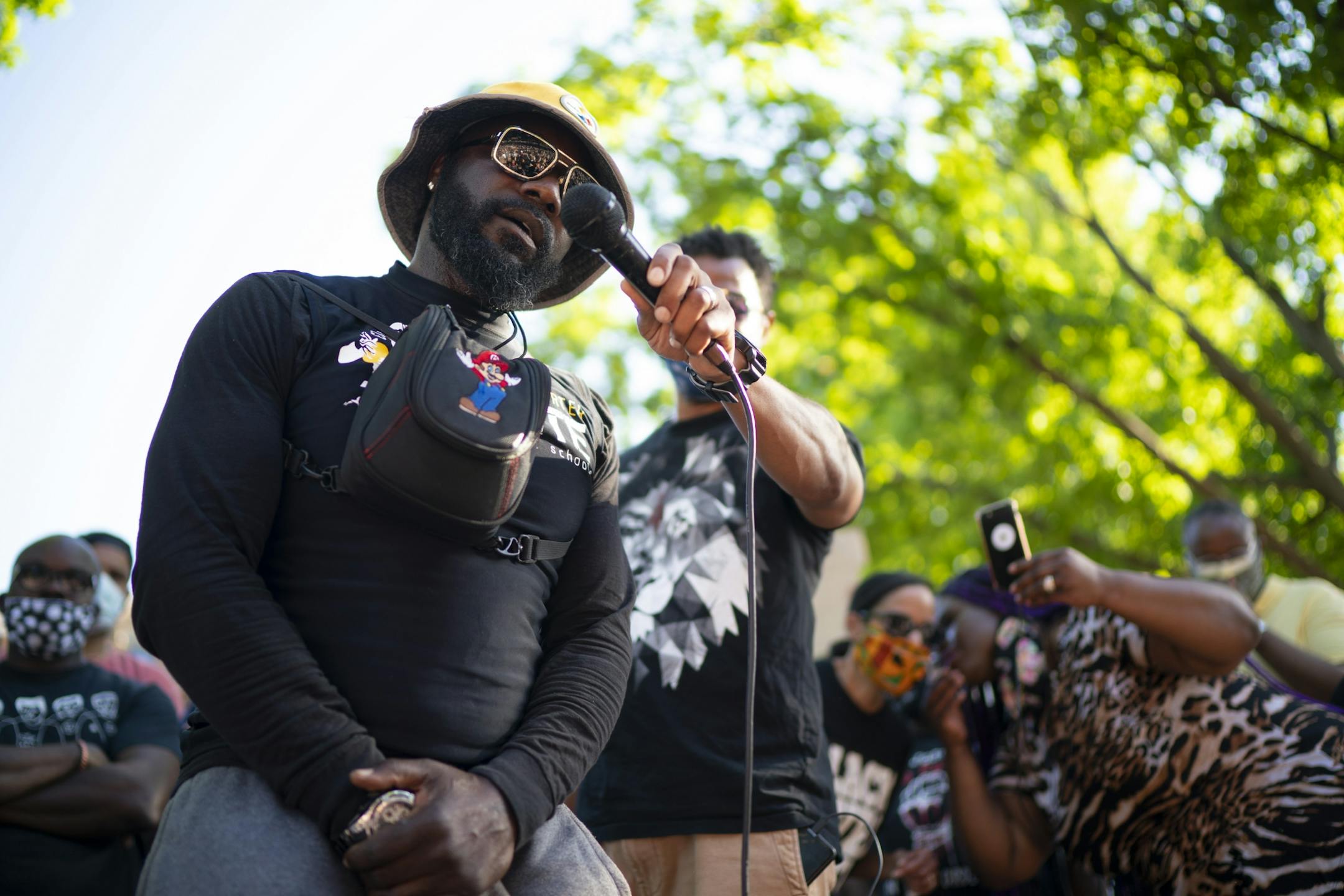 Tyrone Carter was the final speaker before the program was cut short. He was telling the crowd how important his grandmother, who raised him, made him who he is today.