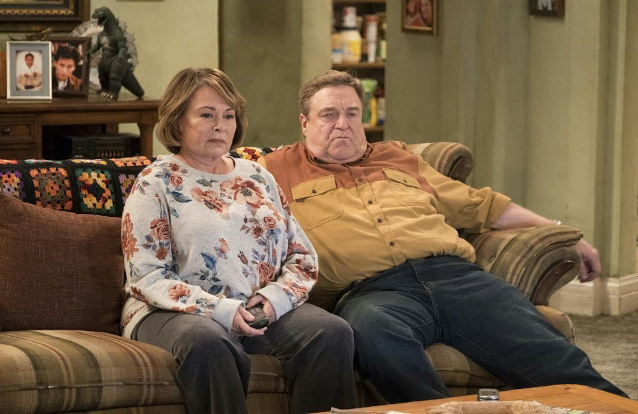 FILE - In this image released by ABC, Roseanne Barr, left, and John Goodman appear in a scene from the reboot of "Roseanne," premiering on Tuesday at 8 p.m. EST. For the reboot, Roseanne will be at odds with her sister Jackie, played by Laurie Metcalf, over President Donald Trump. Barr said she thought it was important to show how the Conner family deals with the same issues many American families are facing.