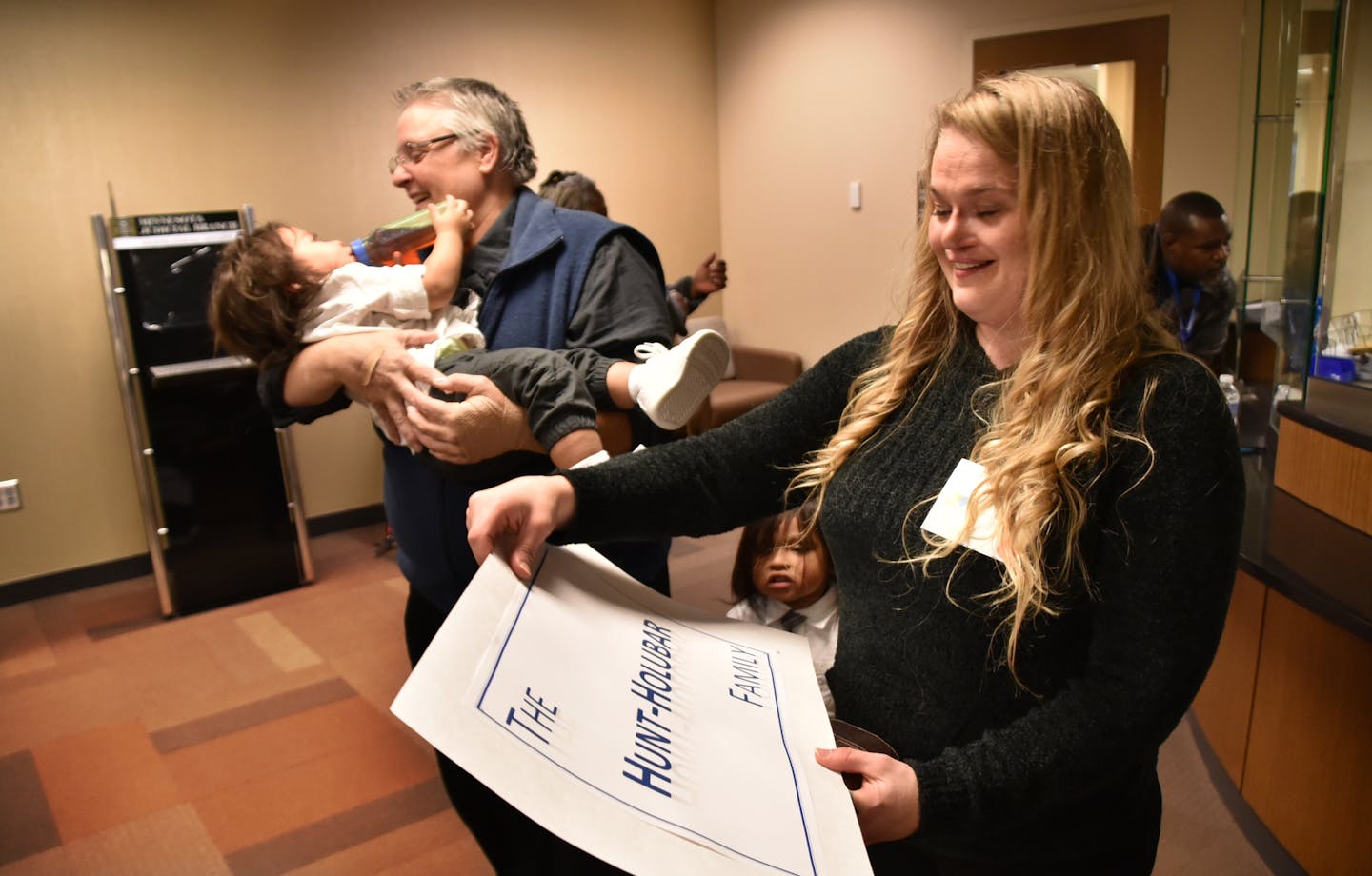 Amy Holubew and Dawn Hunt have just become parents of 4 kids with the filing of adoption court papers. Seen here leaving the District Court office with Zachary and Jack Hunt-Holubar. ] On National Adoption Day this Saturday, 41 Hennepin County children will have a chance for a new beginning, and 27 families will embark on a new chapter in their lives together.Adoption Day is a time for celebration at the Juvenile Justice Center, as parents and children come together in a finalization hearing bef