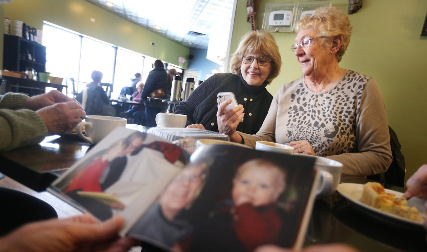 Joan Brown of Inver Grove Heights, left and Joanne Yamka of South St. Paul looked a photographs as they gathered for coffee with high school friends at Black Sheep Coffee Cafe Thursday Feb 04, 2016 in South St. Paul, MN. ] The four women were graduates of the 1961 class at South Saint Paul High school. Women voters give their thoughts at Black Sheep Coffee Cafe about Hillary Clinton. Jerry Holt/Jerry.Holt@Startribune.com