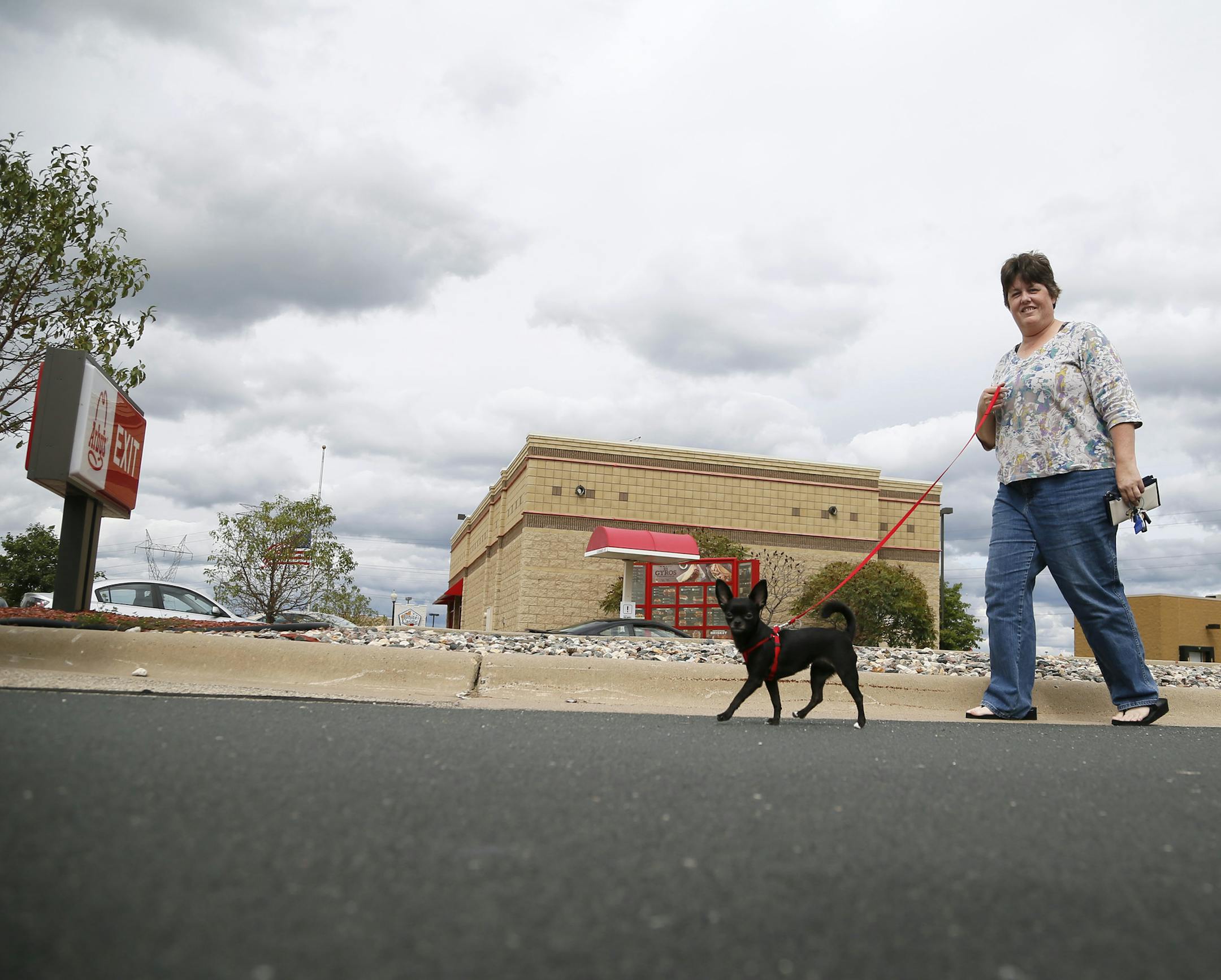 Leanna Boone walked her dog "Tater" near the scene at an Arby's drive thought were Ty Hoffman was arrested for murder. Lyle "Ty" Hoffman was arrested at an Arby's in the 8000 block of Old Carriage Court Thursday September 11 , 2014 in Shakopee , MN. ] Jerry Holt Jerry.holt@startribune.com