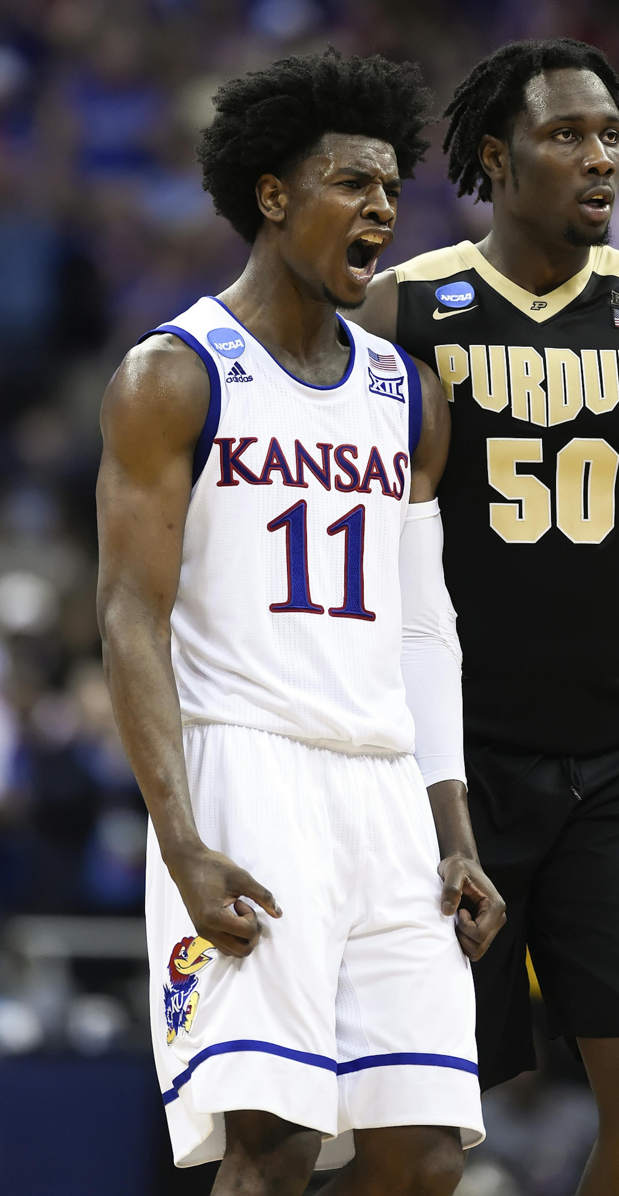 Kansas guard Josh Jackson (11) shouts next to Purdue forward Caleb Swanigan (50) in the second half during the Sweet Sixteen round of the NCAA Tournament at Sprint Center in Kansas City, Mo., on Thursday, March 23, 2017. Kansas advanced, 98-66. (Shane Keyser/Kansas City Star/TNS) ORG XMIT: 1199501