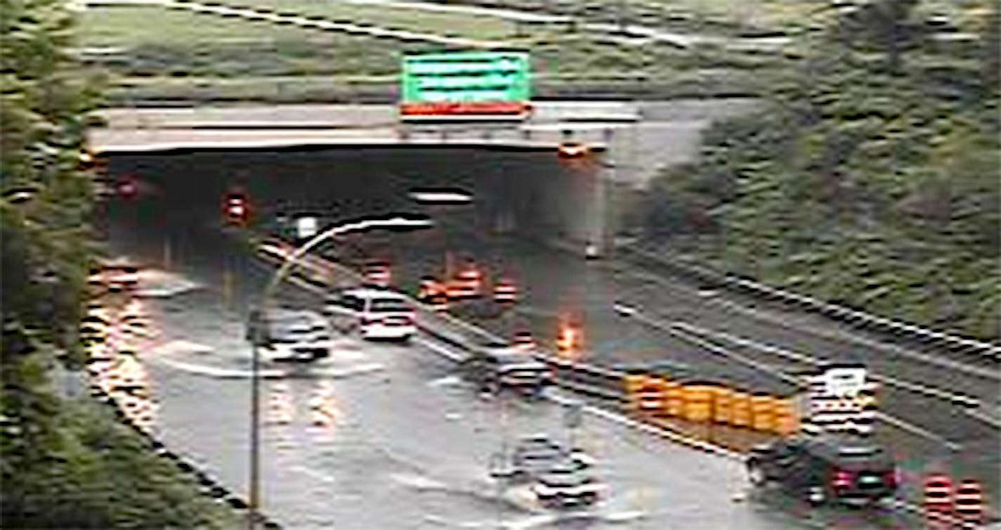 Flooding on Hwy. at the tunnel near Fort Snelling slowed commuters early Monday.Flooding on Highway 5 at the tunnel near Fort Snelling slowed commuters early Monday.