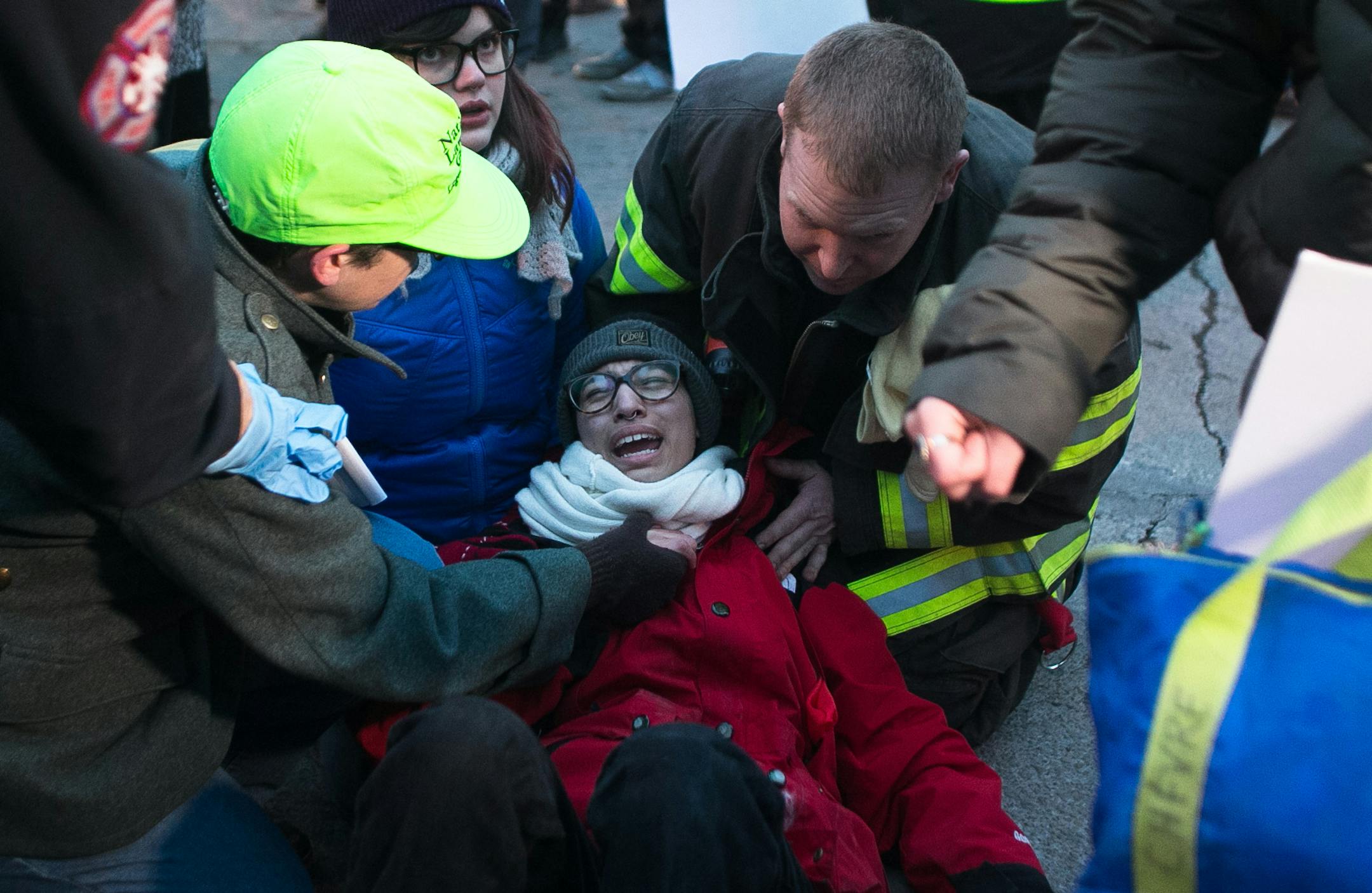 Demonstrators and first responders tend to the injuries of a woman who was hit by a car which plowed through protestors in the intersection of East Lake Street and Minnehaha. ] AARON LAVINSKY • aaron.lavinsky@startribune.com Protesters demonstrate against a grand jury's decision not to indict Darren Wilson, the police officer who killed Michael Brown, an unarmed African American teenager, this past August in Ferguson, Mo. The demonstration was photographed Tuesday, Nov. 25, 2014 in Minnea