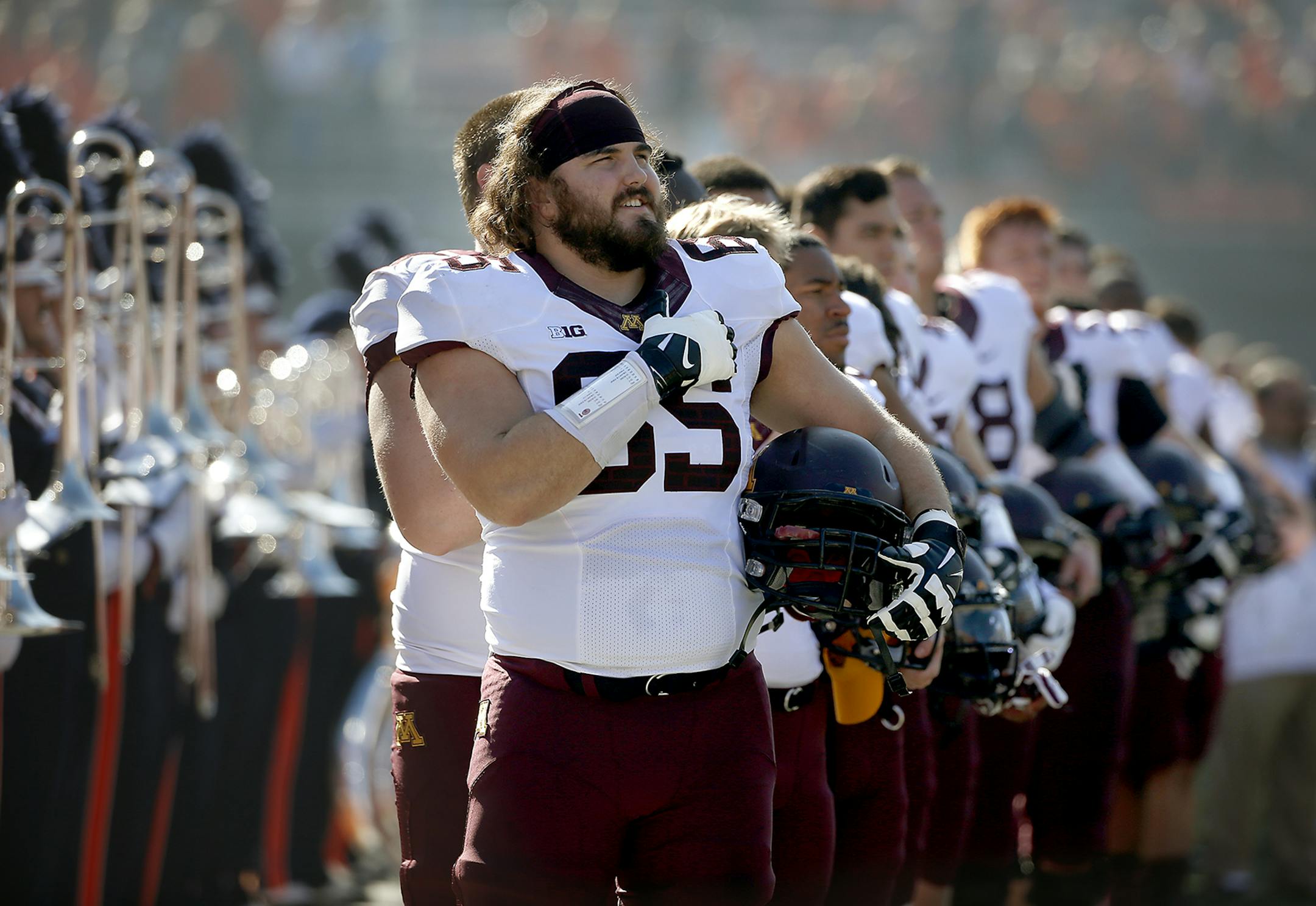 Gophers offensive lineman Josh Campion joined other players as they stood for the National Anthem before the game against Illinois, Saturday, October 25, 2014 in Champaign, IL. ] (ELIZABETH FLORES/STAR TRIBUNE) ELIZABETH FLORES &#x2022; eflores@startribune.com ufot110214 ORG XMIT: MIN1410281124216209