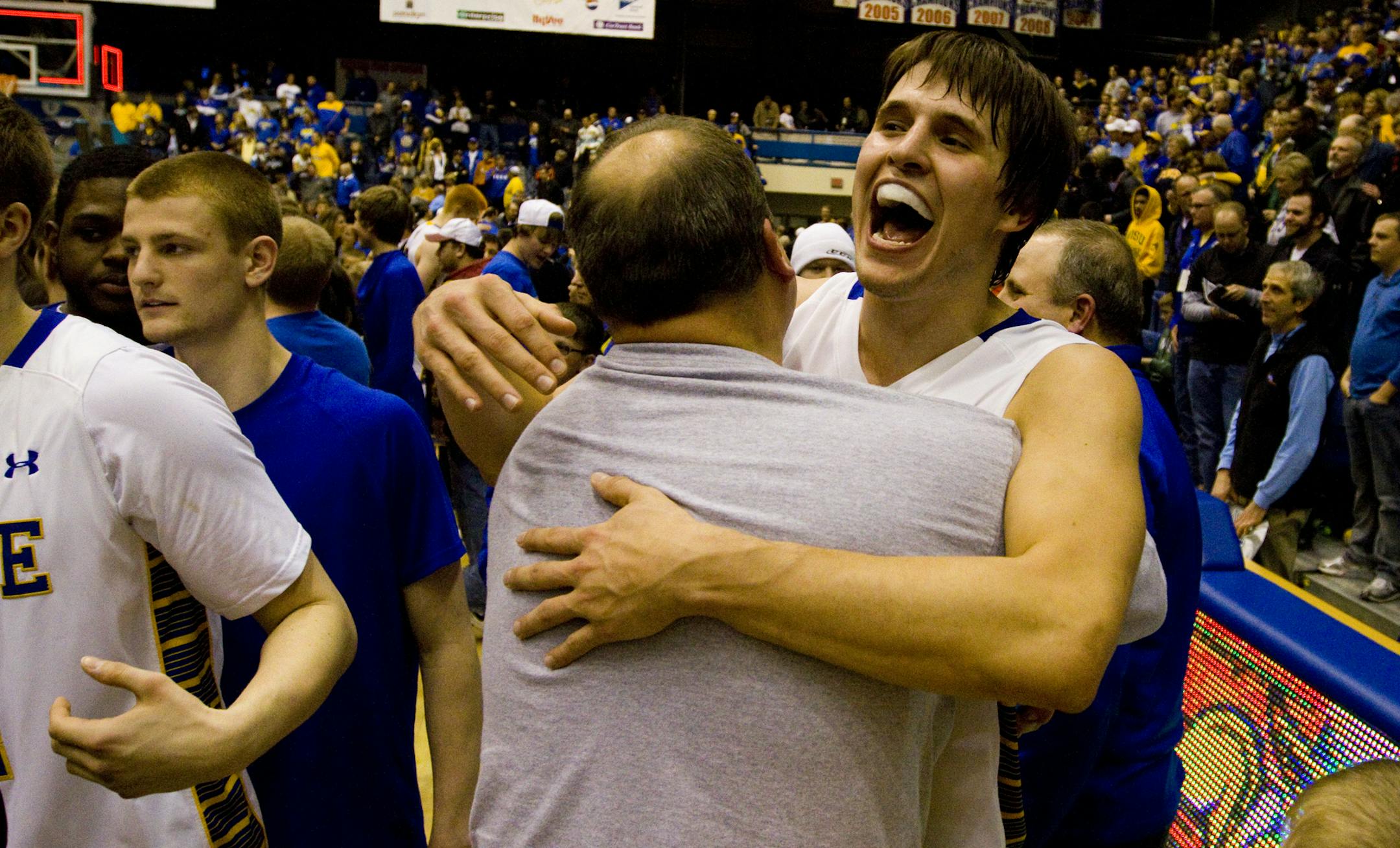 Jordan Dykstra (42) of South Dakota State University celebrates after the Jackrabbits beat North Dakota State University to advance to the NCAA Division I Tournament. The Jacks beat the Bison 73-67 in the Summit League men's basketball tournament title game Tuesday, March 12, 2013, in Sioux Falls, S.D. (AP Photo/Elijah Van Benschoten) ORG XMIT: SDEVB104