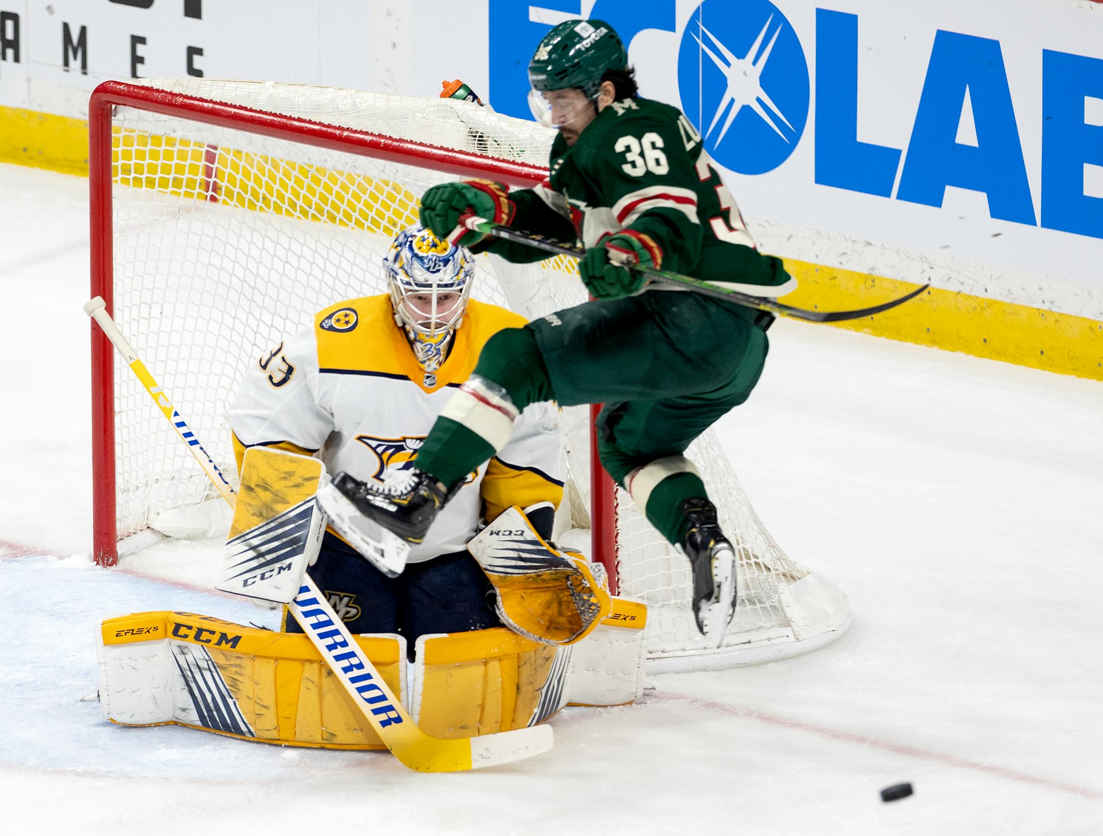 Matts Zuccarello (36) of the Minnesota Wild attempts to get out of the way of a shot in front of Nashville Predators goalie David Rittich (33) in the third period.
