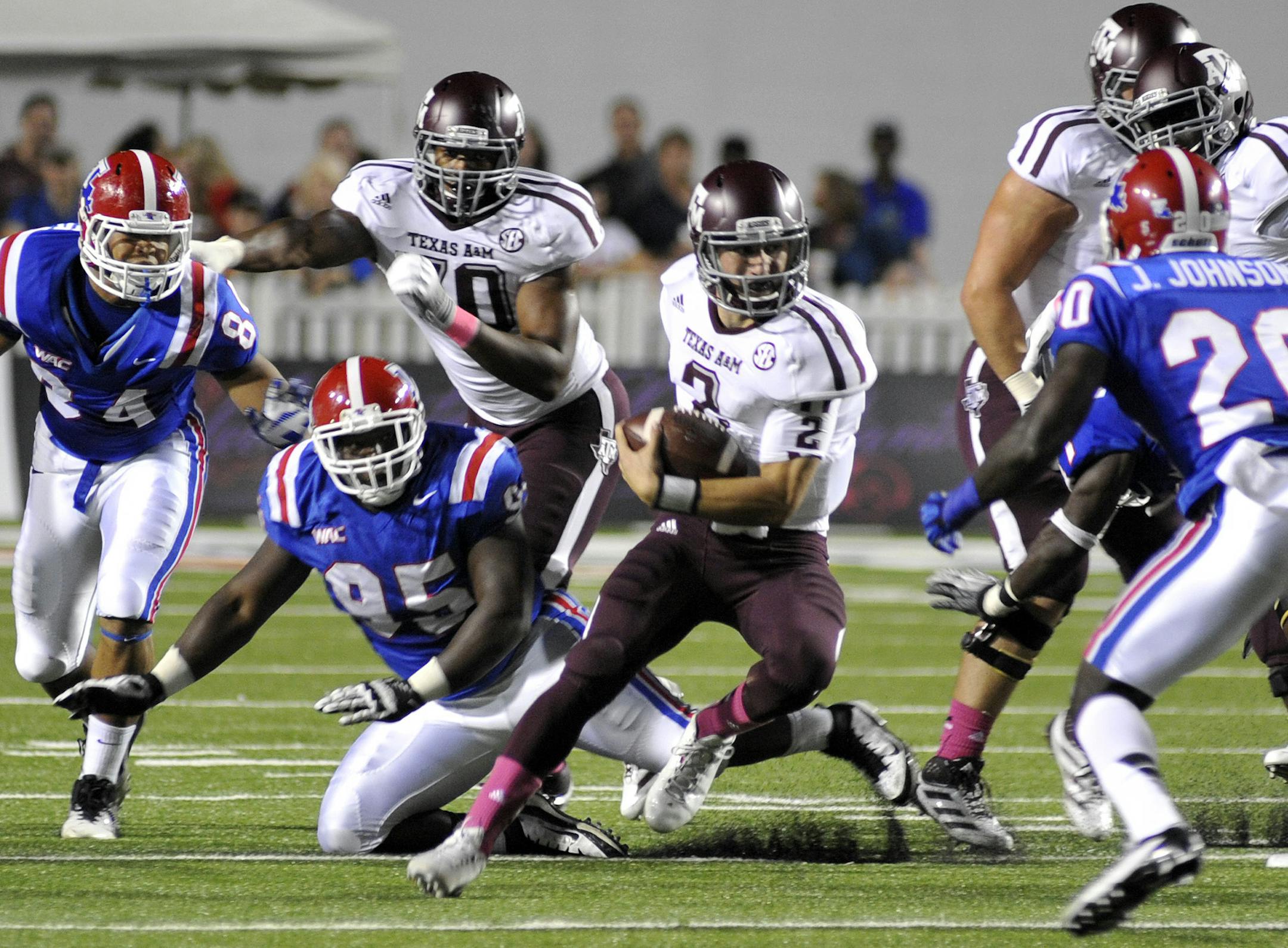 Texas A&M quarterback Johnny Manziel (3) scrambles for yards during an NCAA college football game against Louisiana Tech in Shreveport, La., Saturday, Oct. 13, 2012. (AP Photo/Kita K Wright) ORG XMIT: LAKW101