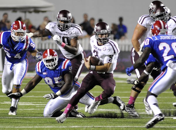 Texas A&M quarterback Johnny Manziel (3) scrambles for yards during an NCAA college football game against Louisiana Tech in Shreveport, La., Saturday,