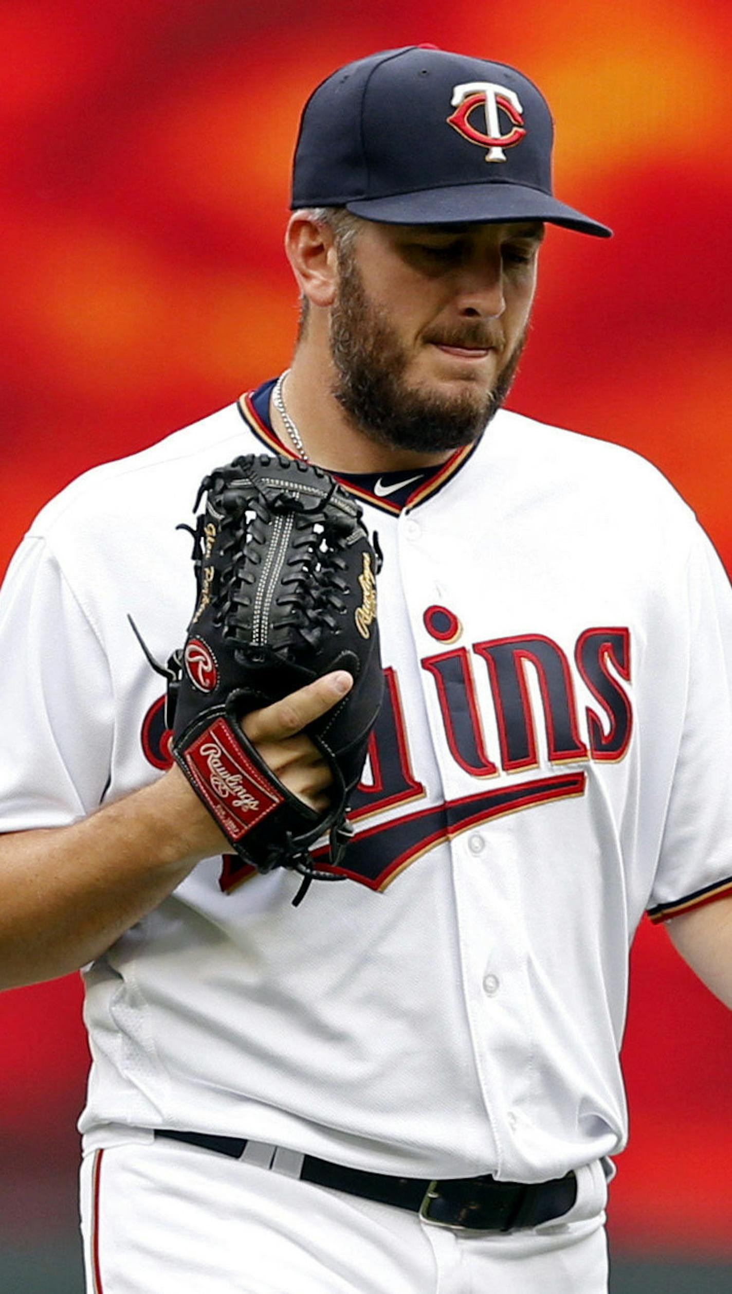 Minnesota Twins pitcher Glen Perkins heads to the mound to pitch for the first time since being on the disabled list for 16 months as he faced the Cleveland Indians in the ninth inning of the first game of a baseball doubleheader Thursday, Aug. 17, 2017, in Minneapolis. The Indians won 9-3. (AP Photo/Jim Mone)