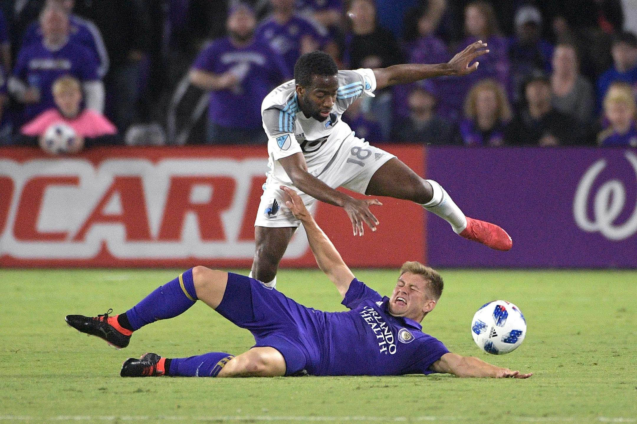 Minnesota United midfielder Kevin Molino (in white) battles for the ball during the first half of an MLS soccer match Saturday, March 10, 2018, in Orlando, Fla. Minnesota won 2-1.(AP)
