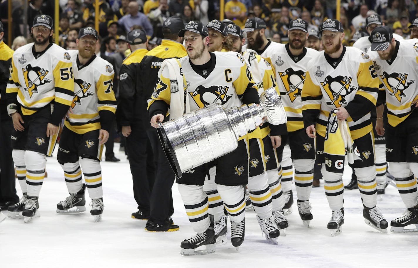 Pittsburgh Penguins' Sidney Crosby (87) celebrates with the Stanley Cup after defeating the Nashville Predators in Game 6 of the NHL hockey Stanley Cup Final, Sunday, June 11, 2017, in Nashville, Tenn. (AP Photo/Mark Humphrey)