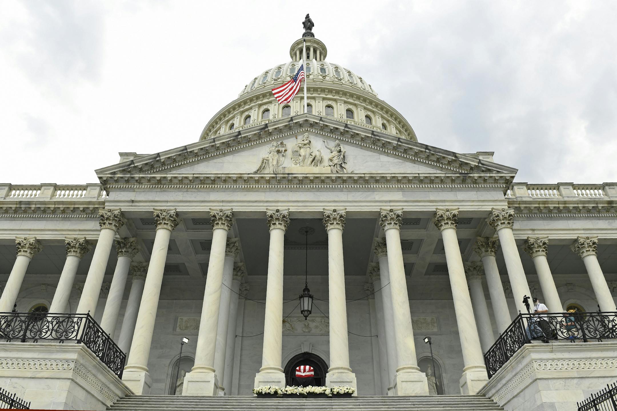 The flag-draped casket of the late Rep. John Lewis, D-Ga., lies in state at the top of the East steps of Capitol Hill in Washington, Tuesday, July 28, 2020. (AP Photo/Susan Walsh)