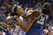 Phoenix Mercury's Candice Dupree (4) scrambles with Minnesota Lynx's Devereaux Peters (14) and Maya Moore for a loose ball during the first half of a 