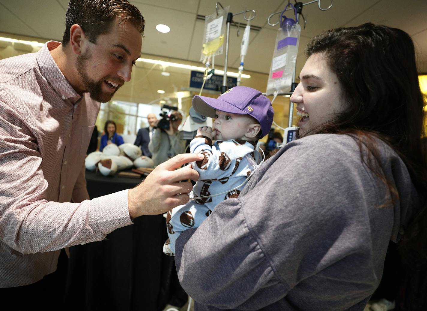 Emma McClure and her 9-month-old son, Easton, visited with Adam Thielen at the U of M Masonic Children's Hospital.