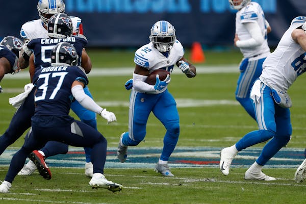 Detroit Lions running back D'Andre Swift runs against the Tennessee Titans during the first half of an NFL football game Sunday, Dec. 20, 2020, in Nas