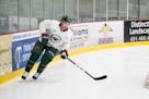 Quincey waived by Wild; Parise skates for first time since surgery