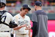Twins pitcher Kenta Maeda hands the ball to manager Rocco Baldelli before leaving in the eighth inning on Thursday.