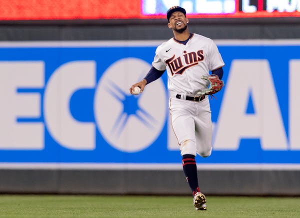 Byron Buxton reacted after making a catch in the fifth inning Monday night. He was playing with a broken pinky finger.