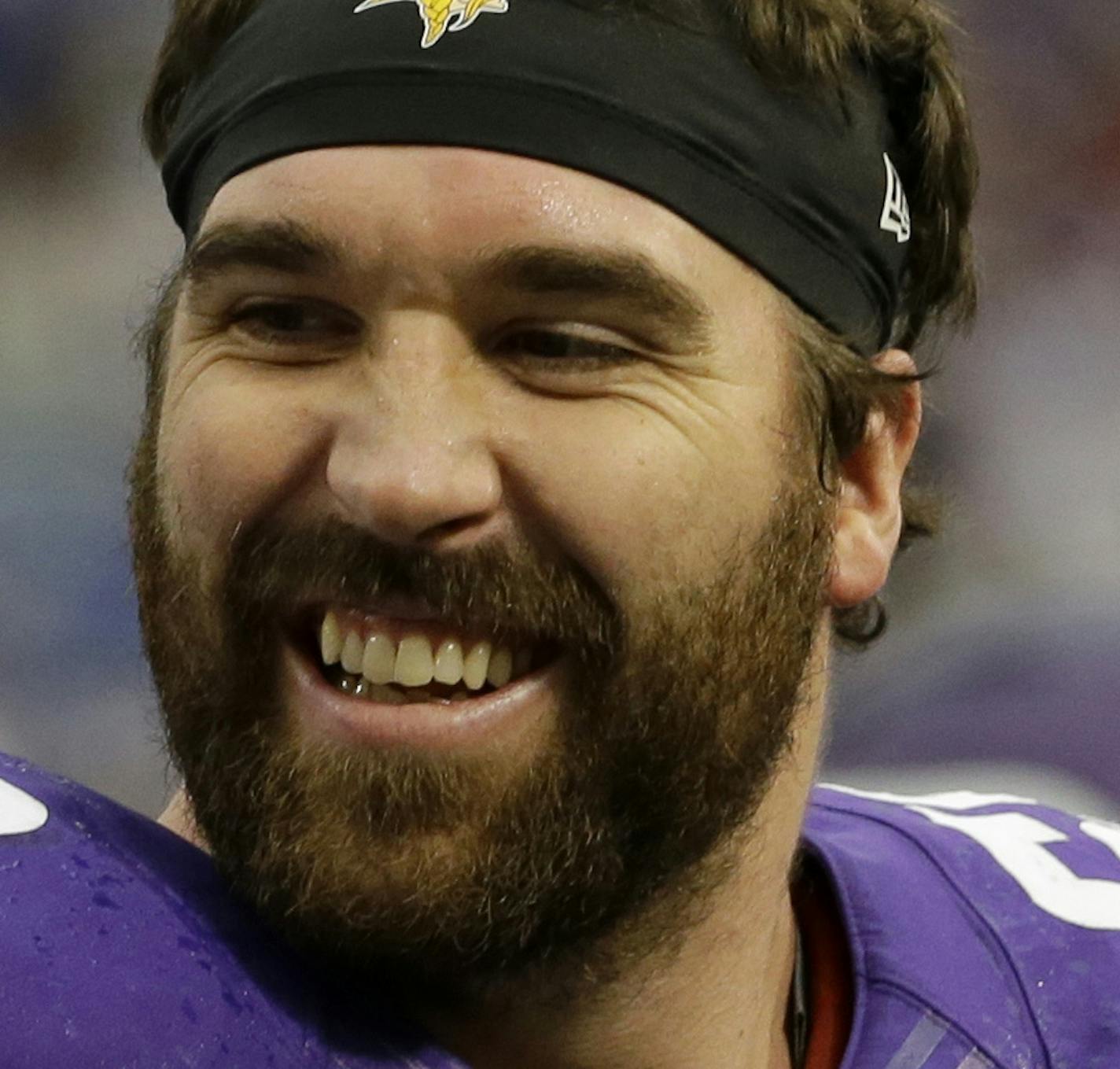 FILE - In this Dec. 29, 2013 file photo, Minnesota Vikings outside linebacker Chad Greenway, left, laughs with teammate Jared Allen before an NFL football game against the Detroit Lions, in Minneapolis. The Minnesota Vikings have signed defensive end Jared Allen to a ceremonial one-day contract to allow the four-time All-Pro to formally retire as a member of the team. The Vikings made the announcement Thursday, April 14, 2016. (AP Photo/Ann Heisenfelt, File)