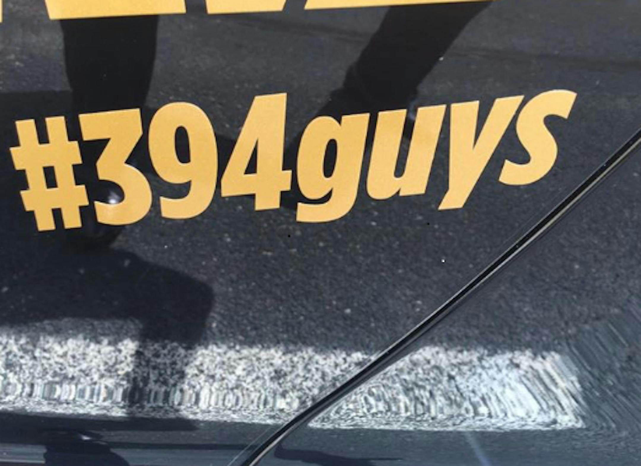 This car decal speaks for itself in connection with the exotic sports car owners accused of speeding in a pack on I-394 this spring.