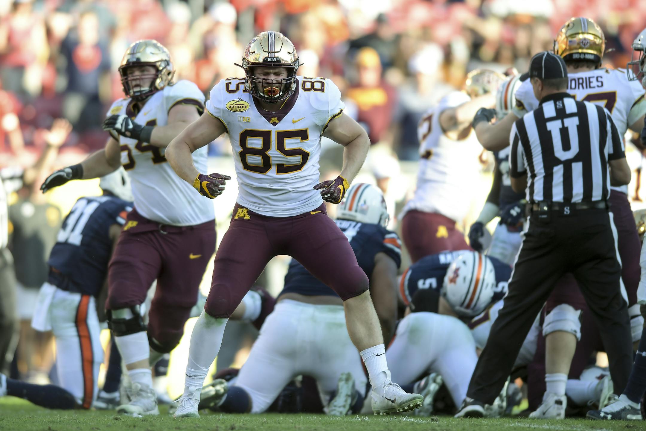 Minnesota Gophers tight end Bryce Witham (85) celebrated as running back Mohamed Ibrahim (24) ran for a first down late in the fourth quarter against the Auburn Tigers. ] Aaron Lavinsky • aaron.lavinsky@startribune.com The Minnesota Gophers played the Auburn Tigers in the Outback Bowl on Wednesday, Jan. 1, 2020 at Raymond James Stadium in Tampa, Fla.