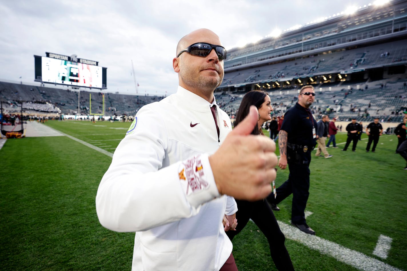 P.J. Fleck walks off the field following Saturday's win at Michigan State.