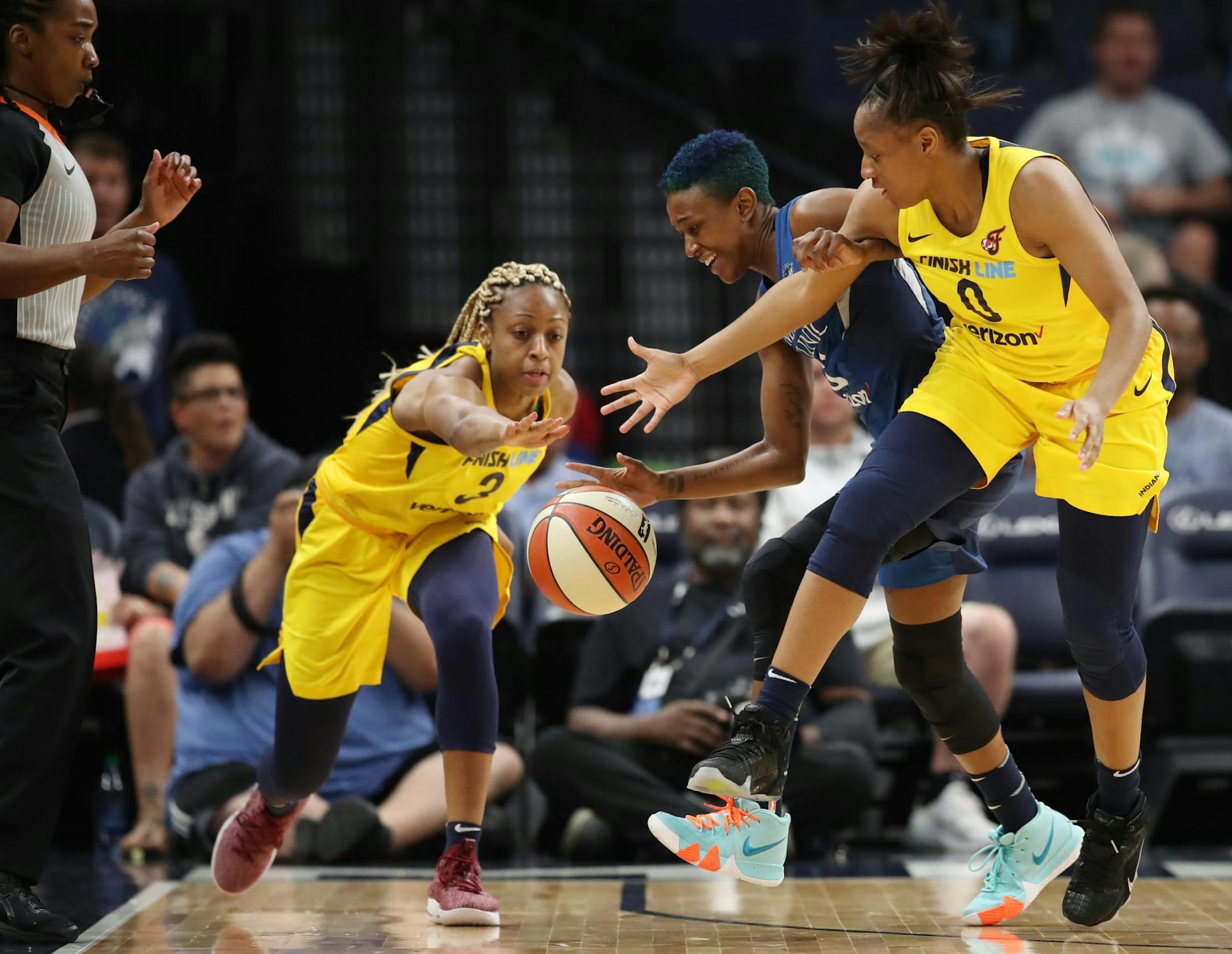 Lynx Danielle Robison was fouled by Fever Kelsey Mitchell (right) as teammate Tiffany Mitchell reached for the ball at Target Center Wednesday July 18, 2018 in Minneapolis , MN.