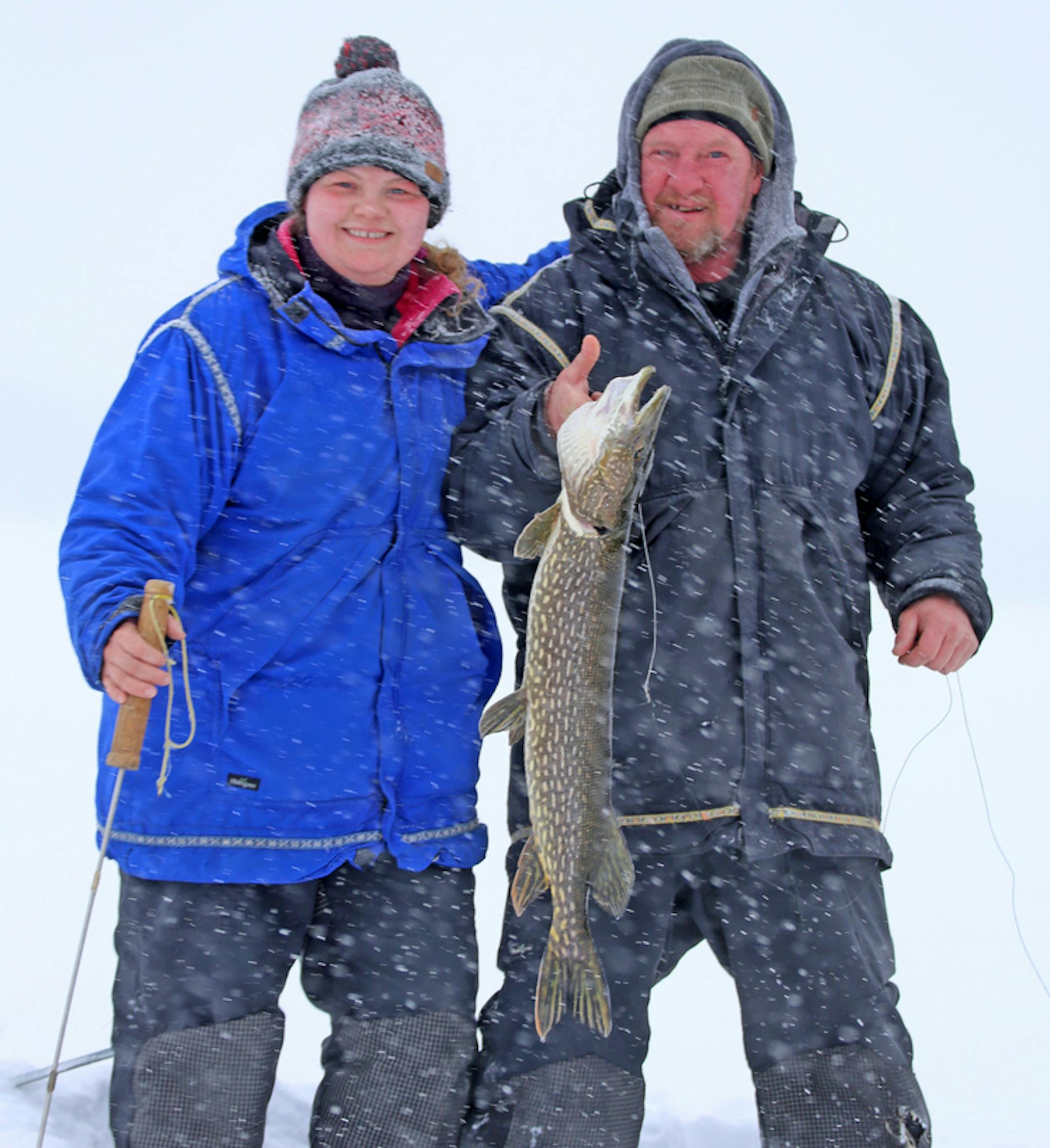 Shelby McEntyre, left, of Ely and her dad, Stu, with a northern pike caught on a dog sled trip into the Boundary Waters Canoe Area Wilderness. Deep snow in the BWCA this winter has made some of their trips challenging. ORG XMIT: MIN1902150856370518