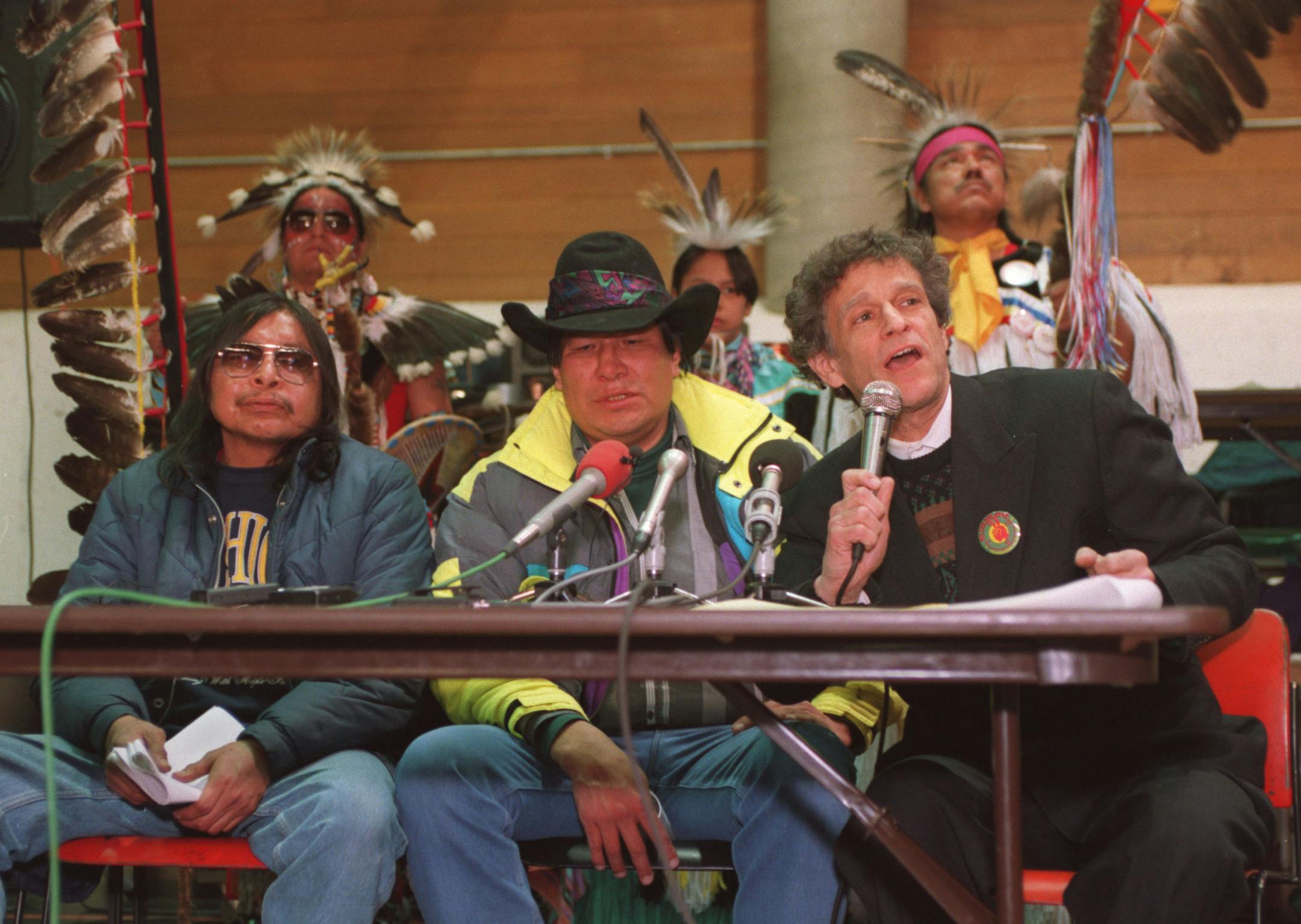 (This is a file photo by Joey McLeister.) (Left to right) John Boney, Charles Lone Eagle and Atty. Larry Leventhal hold a press conference concerning a lawsuit against two Minneapolis police officers filed by Leventhal on behalf of Lone Eagle and Boney (the two men transported in the trunk of a squad car). (This ran Jan. 2, 1994.)