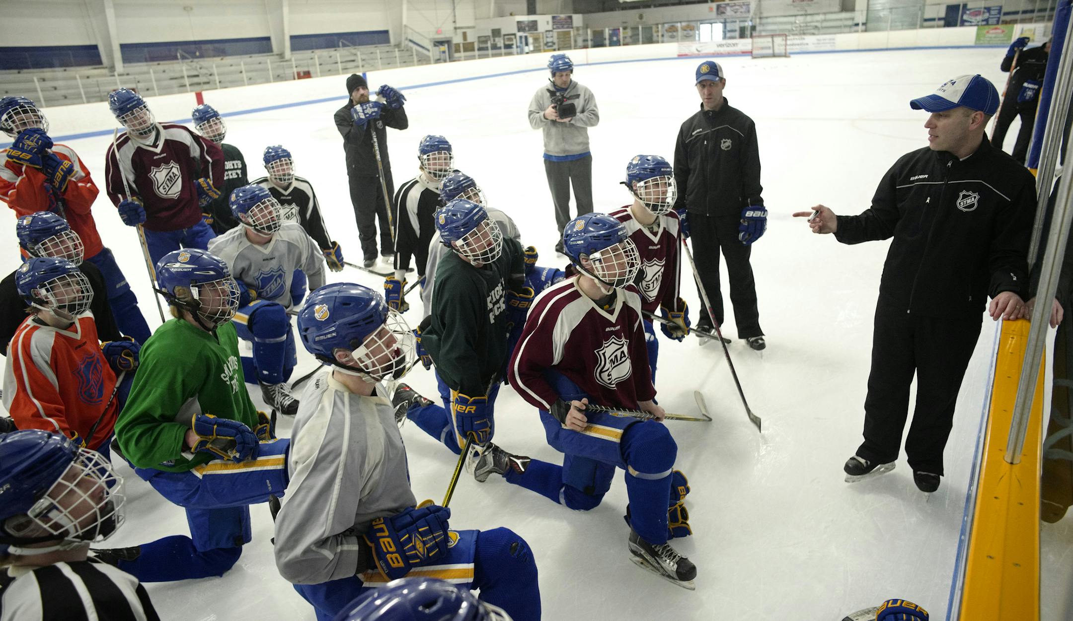 The team listens to tips and tactics from the coaches.]Boys' hockey tournament advance on St. Michael-Albertville, first-time entrant and burgeoning athletic power in Minnesota. Richard Tsong-Taatariiïrtsong-taatarii@startribune.com