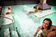 Dimitra Klein, Jaina Portwood and Jimmy Gonzales test out the communal pool at Water Shed Spa in Minneapolis, Minn., on Wednesday, Sept. 28, 2022. The