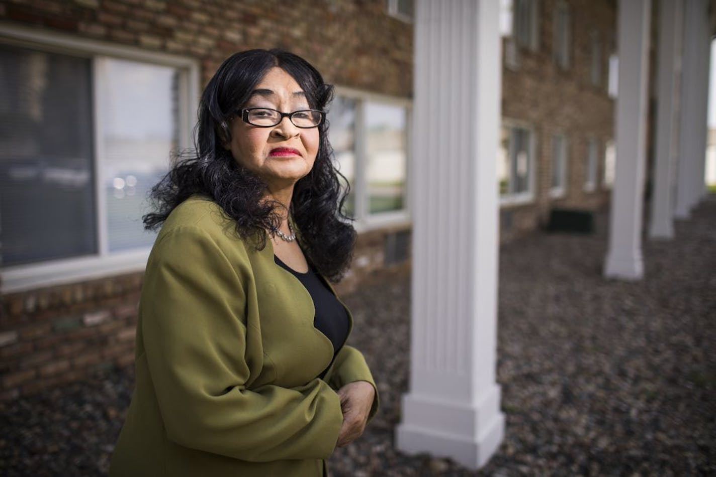 Normandale Lake Estates resident Jurline Bryant poses for a photo in her apartment complex.