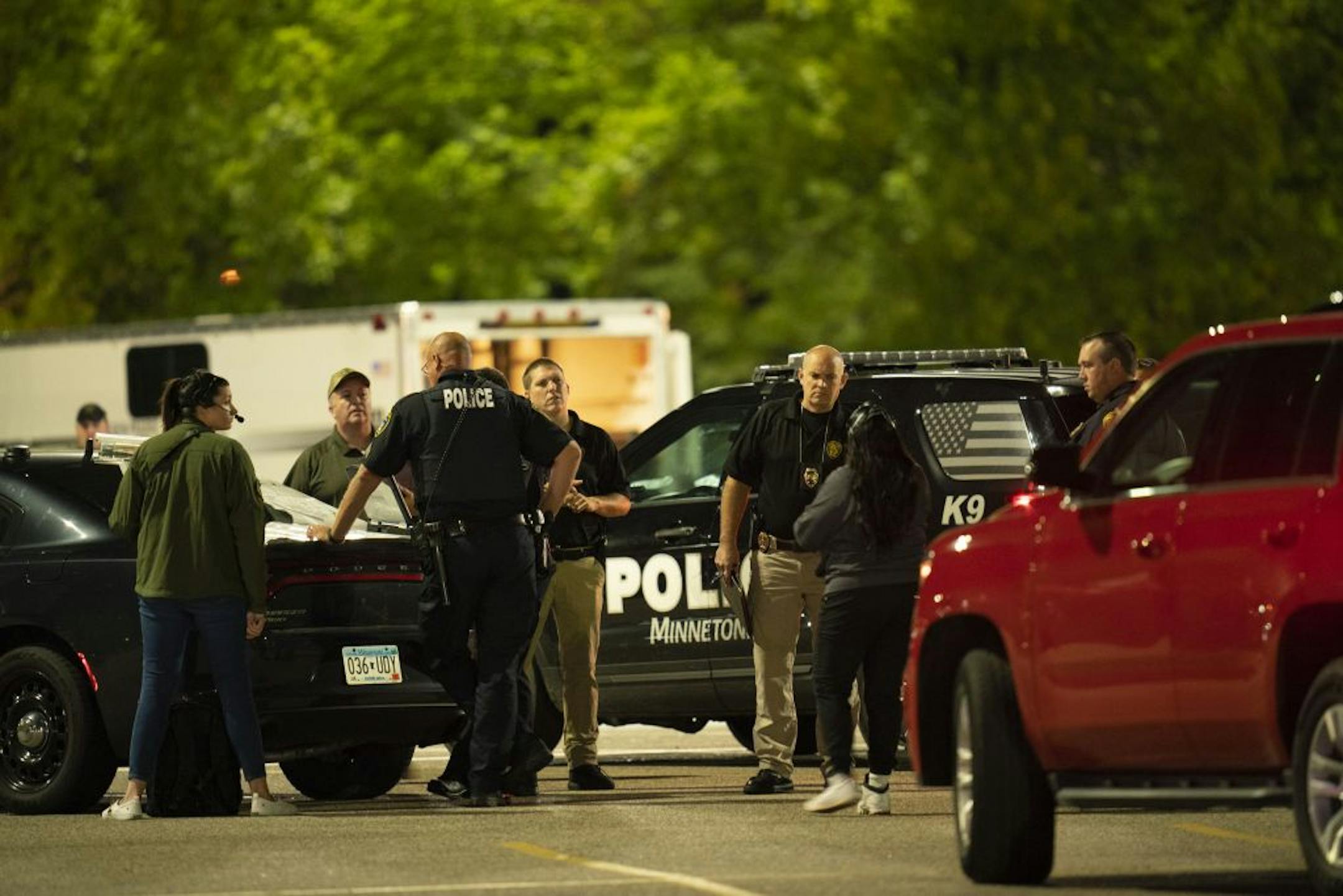 Law enforcement gathered after the shooting in the Southdale parking lot across W. 66th St. from the M Health Fairview Hospital campus.